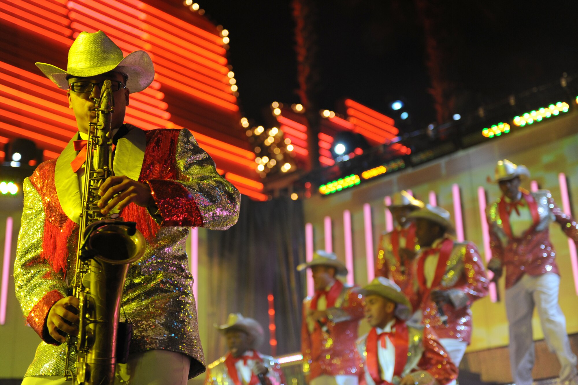 Airman 1st Class Jesse Hernandez-Lora, a saxophonist with Tops in Blue, performs before a large crowd at the Fremont Street Experience, Las Vegas, Nev., Feb. 11. Tops in Blue is an all-active duty U.S. Air Force special unit made up of talented amateur performers who perform for military personnel and their families throughout the world.(U.S. Air Force Photo/Senior Airman Larry E. Reid Jr.)