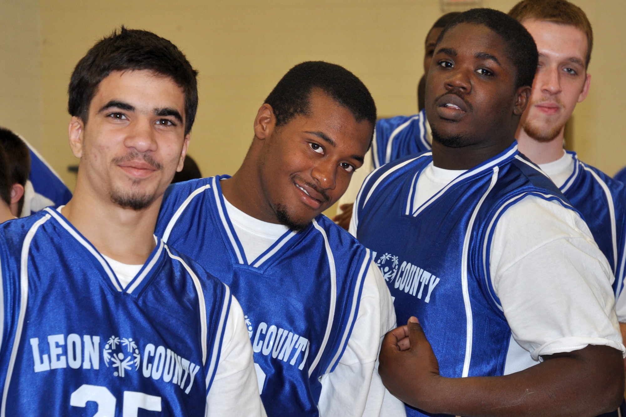 Athletes from the Godby High School Special Olympics basketball team, pose for the camera Feb 5, during the 2009 Northwest Sectional basketball tournament opening ceremony. More than 125 athletes on 17 teams from seven counties throughout Northwest Florida participated in the event. (U.S. Air Force photo/ Airman Anthony Jennings)