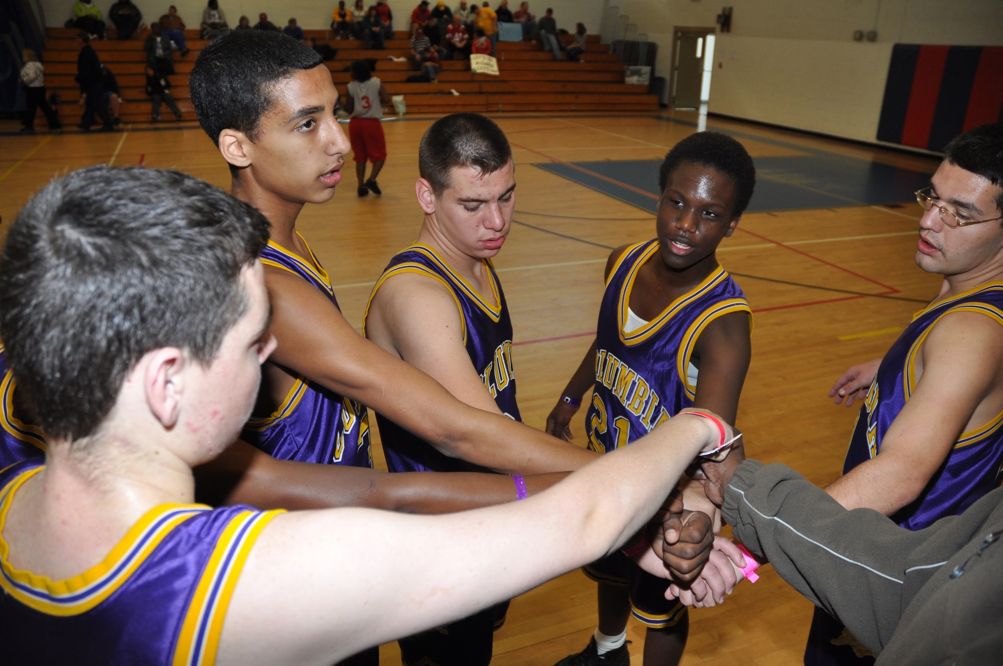 The Columbia High School Tigers Special Olympics basketball team, prepares to break for the second half Feb. 6, for placing in the regional finals during the 2009 Northwest Sectional basketball tournament here. More than 125 athletes on 17 teams from seven counties throughout Northwest Florida participated in the event. (U.S. Air Force photo/ Airman Anthony Jennings)