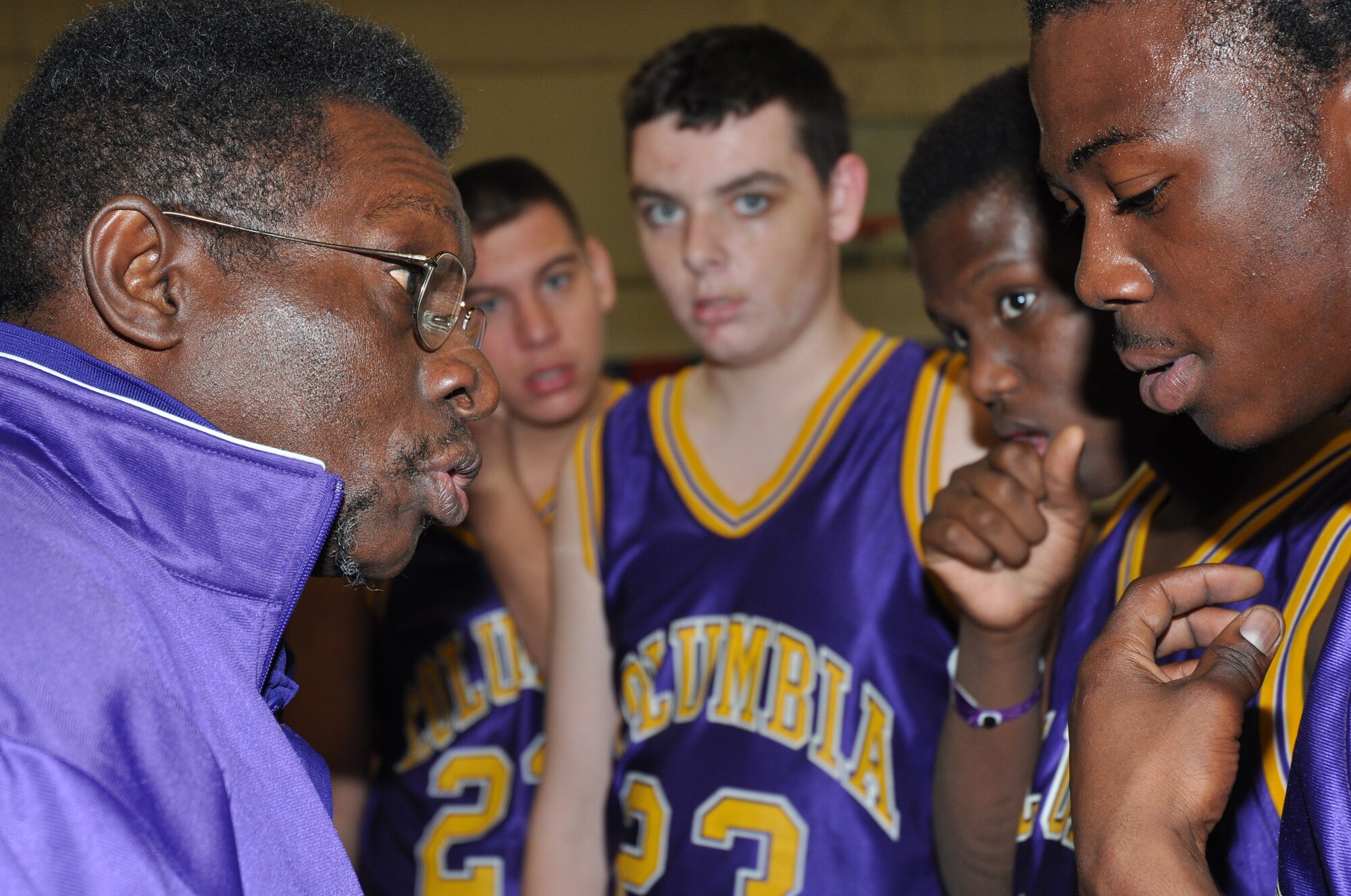 The coach of the Columbia High School Tigers Special Olympics basketball team, motivates his team after a timeout during the 2009 Northwest Sectional basketball tournament here. More than 125 athletes on 17 teams from seven counties throughout Northwest Florida participated in the event. (U.S. Air Force photo/ Airman Anthony Jennings)