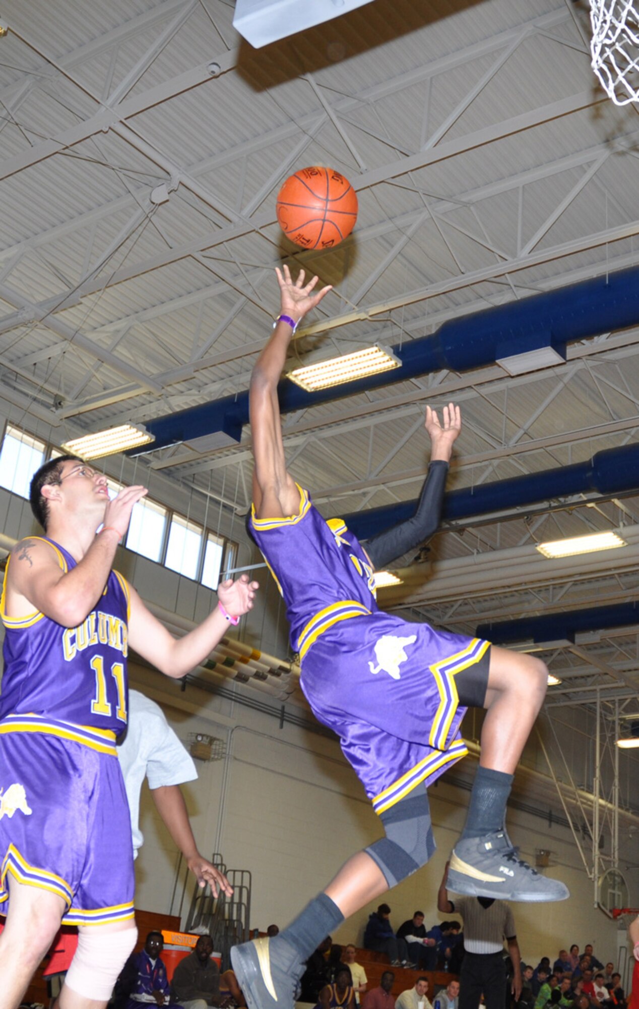 An athlete from the Columbia High School Tigers Special Olympics basketball team, reaches for a rebound Feb 6, during the 2009 Northwest Sectional basketball tournament here. More than 125 athletes on 17 teams from seven counties throughout Northwest Florida participated in the event. (U.S. Air Force photo/ Airman Anthony Jennings)