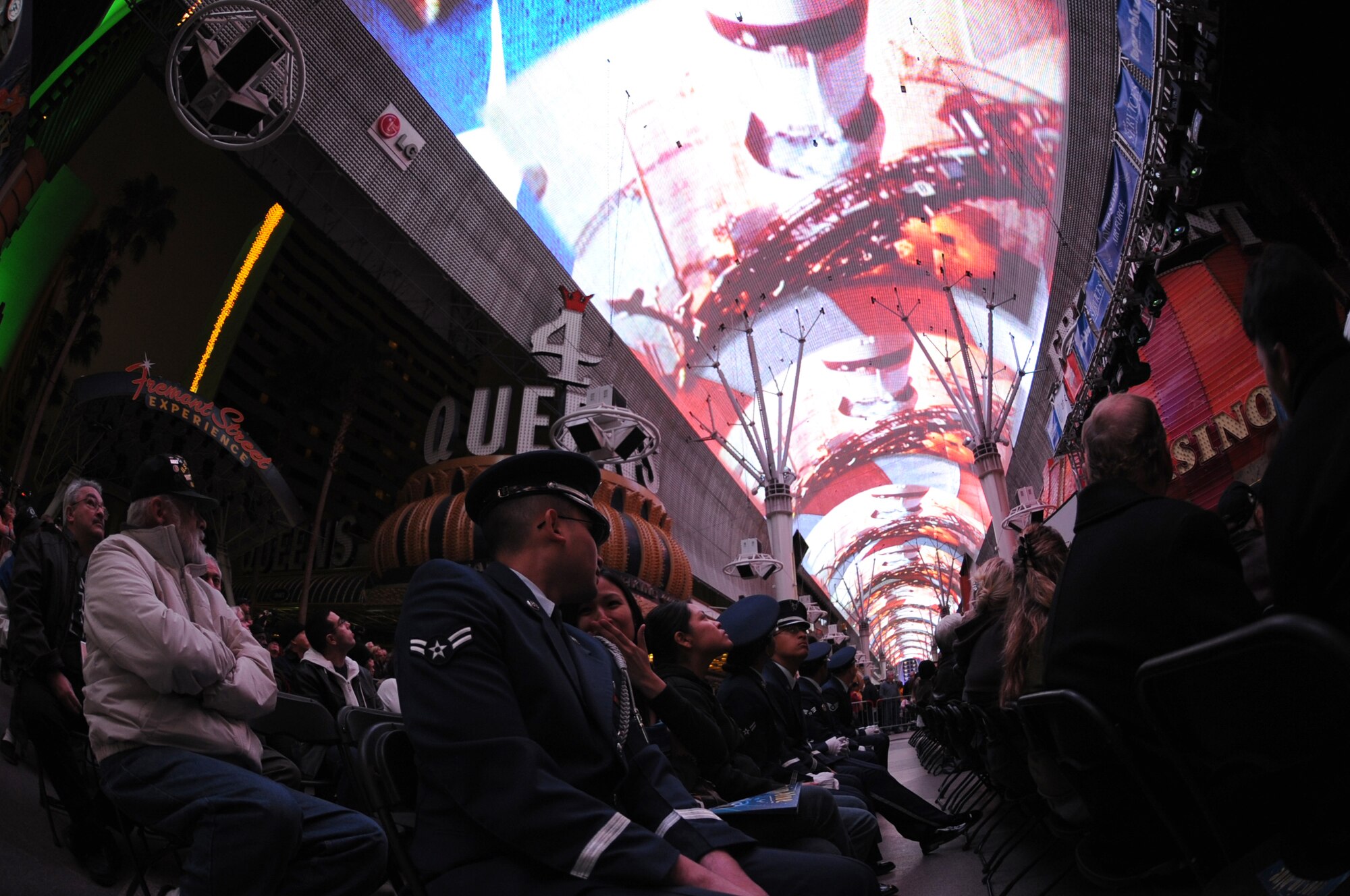 Spectators take in the patriotic light show before the Tops in Blue performance at the Fremont Street Experience, Las Vegas, Nev., Feb. 11. Tops in Blue is an all-active duty U.S. Air Force special unit made up of talented amateur performers who perform for military personnel and their families throughout the world.(U.S. Air Force Photo/Senior Airman Larry E. Reid Jr.)