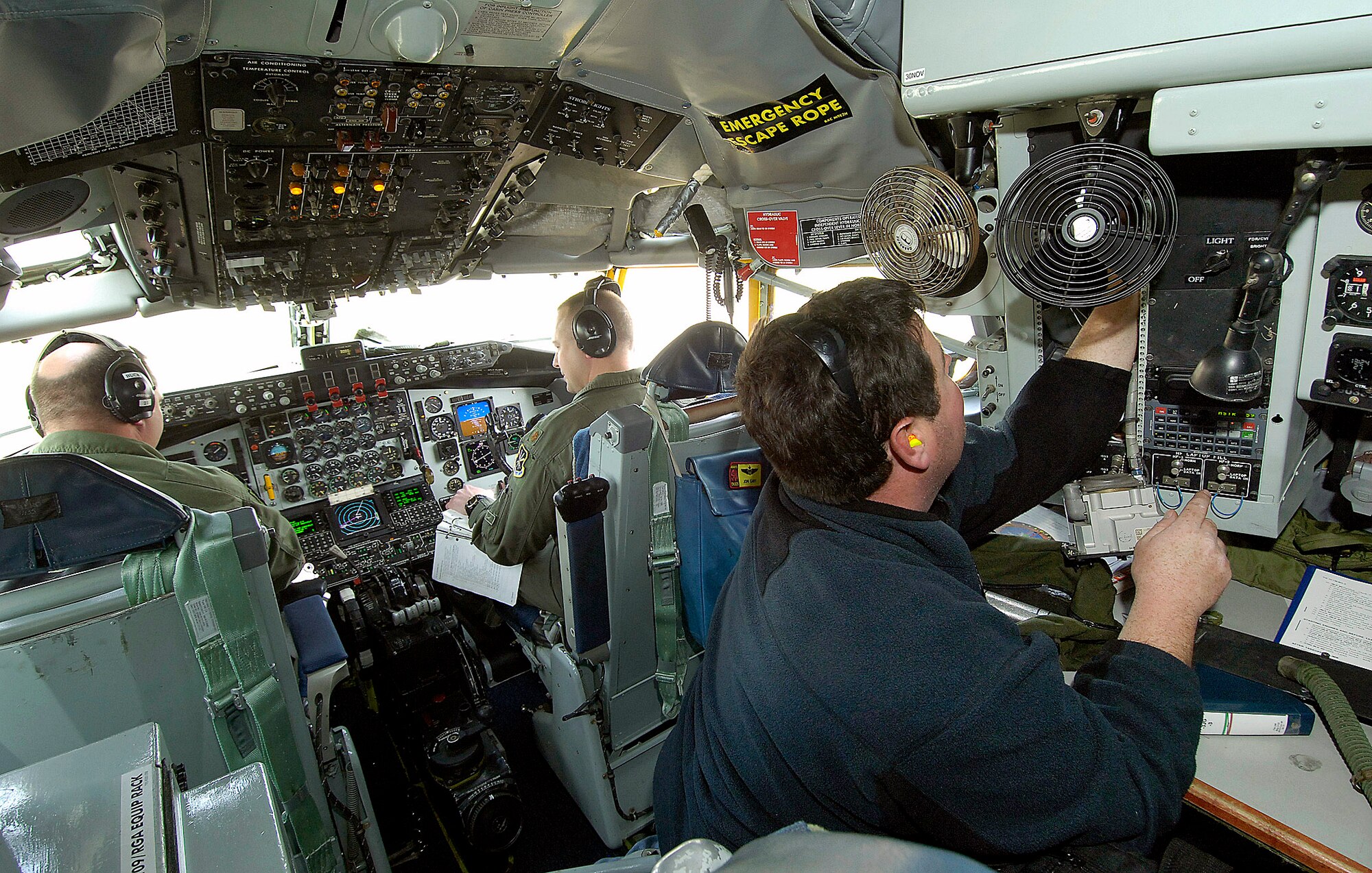 Aircrews from the 10th Flight Test Squadron work closely with Oklahoma Air Logistics Center maintenance professionals during pre-flight inspections on aircraft fresh from the depot at Tinker Air Force Base, Okla.  Here, engine mechanic Matt Jennings, from the 564th Aircraft Maintenance Squadron, along with KC-135 Stratotanker pilots Maj. Kelly Buck (left) and Maj. John Cary are running a meticulous pre-flight inspection that may take up to three hours.  Following that, the aircraft will be flown to ensure its air-worthiness.  (U.S. Air Force photo/Margo Wright)