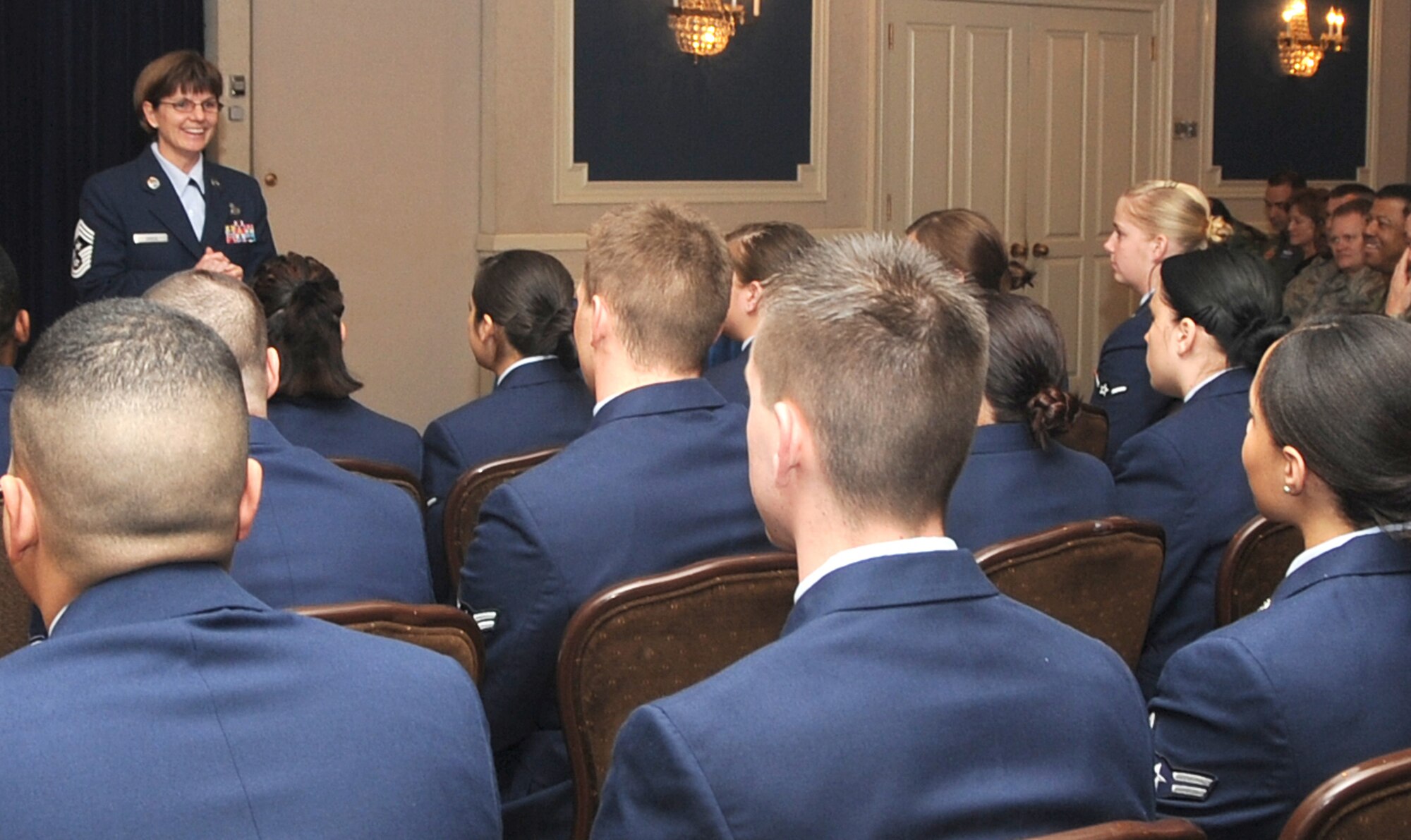 OFFUTT AIR FORCE BASE, Neb.-- 55th Wing Command Chief Master Sgt Lisa Sirois,  expresses the importance of rank and responsibility to Offutt's newest promotees. More than 100 Airman were promoted to their next grade during a ceremony at the Patriot Club Jan. 30. U.S. Air Force Photo by Jeff Gates