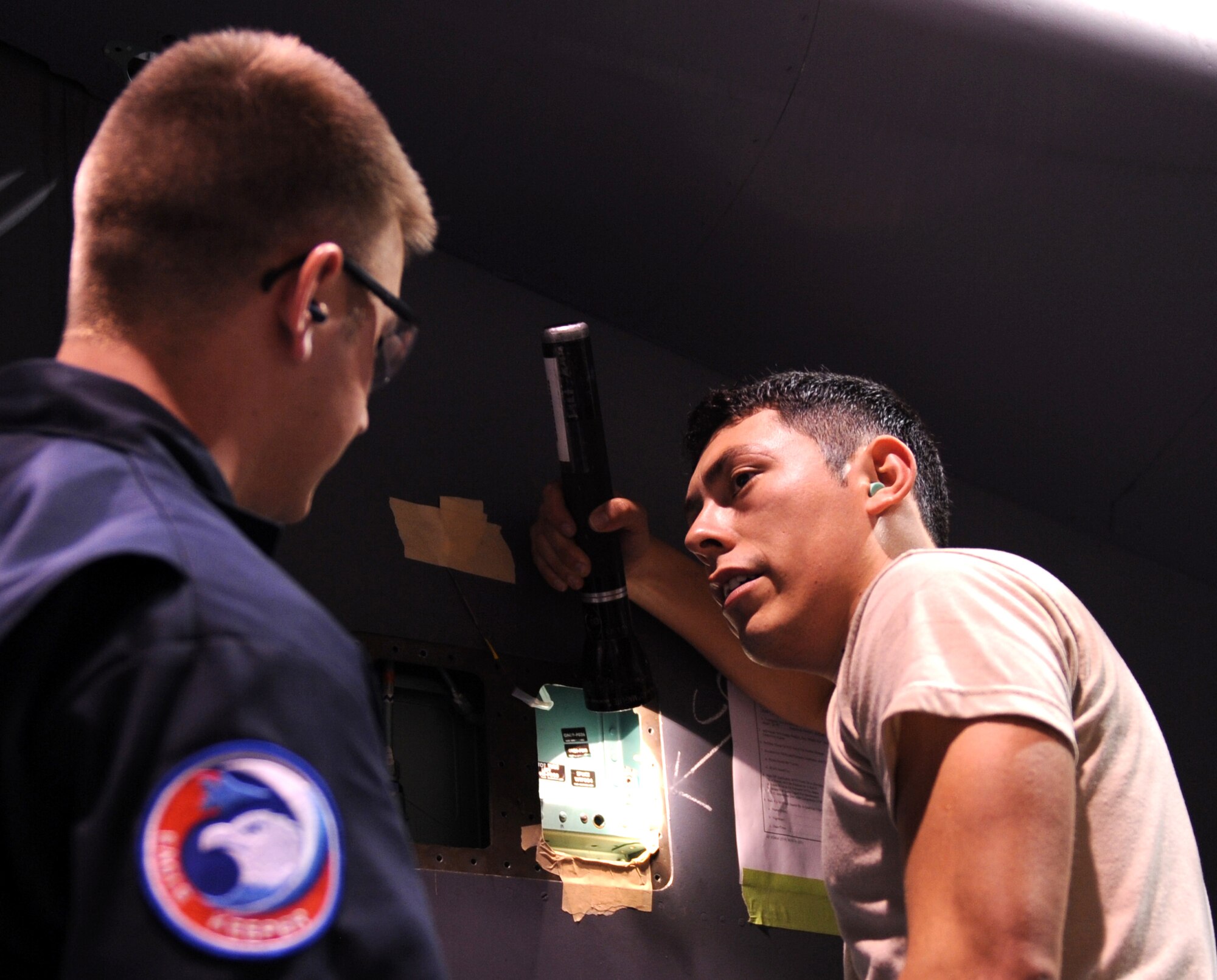 Staff Sgt. Lance Geist (left) Senior Airman Kevin Galdamez, both from the 4th Equipment Maintenance Squadron search for cracks on the inside of an F-15E Strike Eagle during a phase inspection Jan 7, 2009 on Seymour Johnson Air Force Base, N.C. (U.S. Air Force photo by Airman 1st Class Gino Reyes)