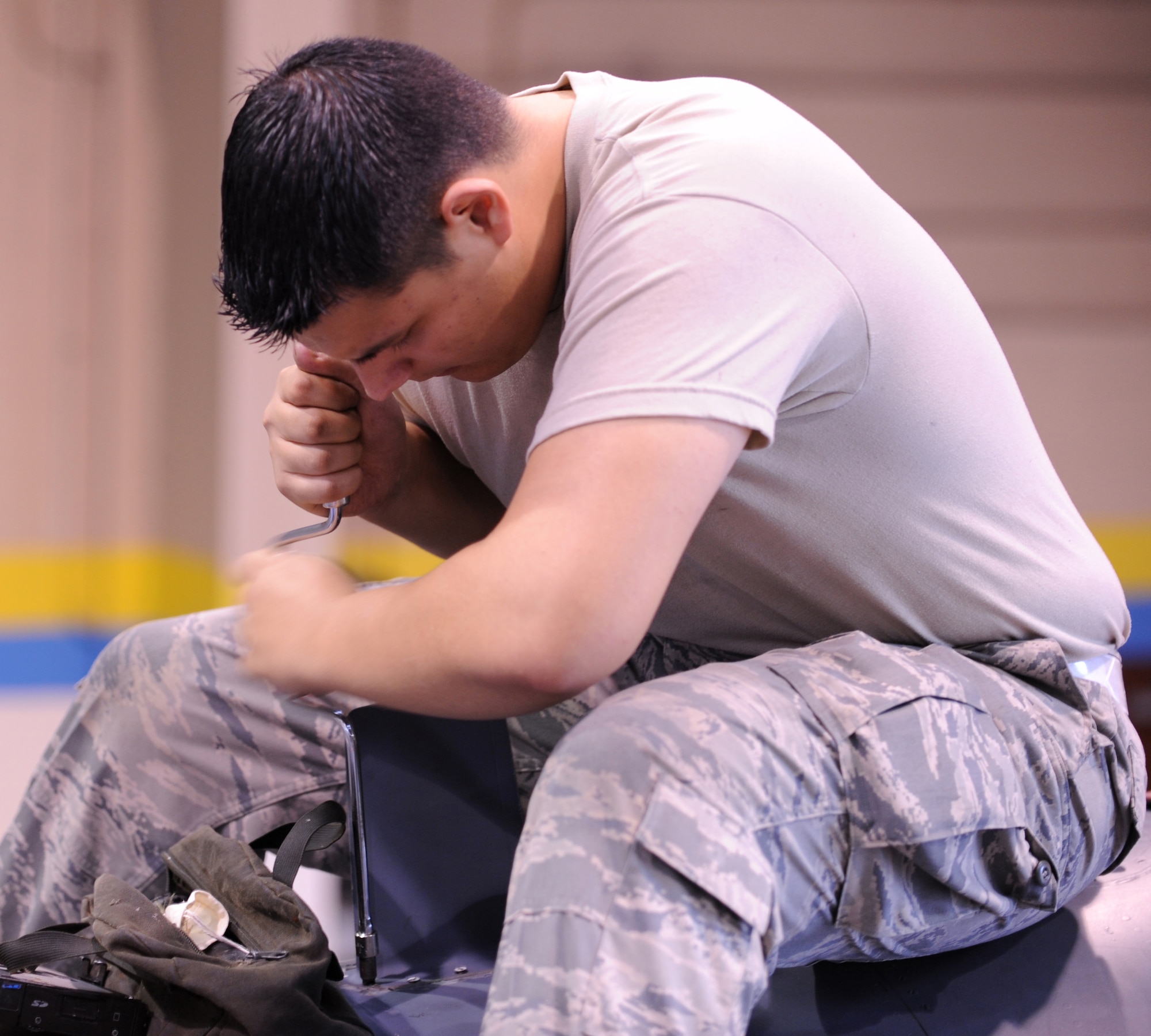 Senior Airman Jason Rollins, 4th Equipment Maintenance Squadron, unscrews a panel from an F-15E Strike Eagle during a phase inspection Jan. 7, 2009 on Seymour Johnson Air Force Base, N. C. (U.S. Air Force photo by Airman 1st Class Gino Reyes)