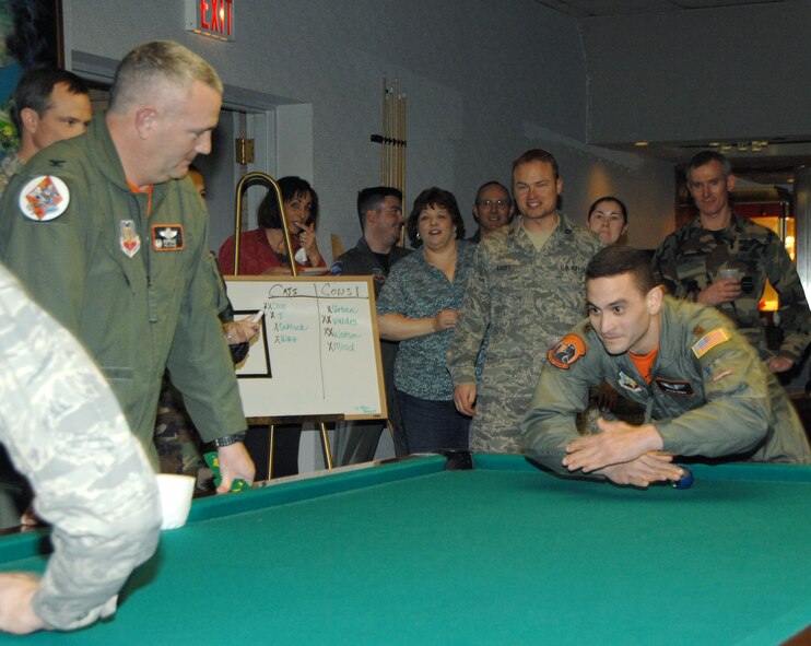 OFFUTT AIR FORCE BASE, Neb. -- Maj. Jason Riera, Assistant Director of Operations, 55th Combat Training Squadron, plays a game of "Crud" during a tournament at the Patriot Club Feb.  6. The tournament winners were Col. Thomas Goffus, 55th Mission Support Group commander, Lt. Col. Mitchell Maddox, 55th Mission Support Group deputy commander, Lt. Col. John Jacobson, 55th Contracting Squadron commander and Capt. Stephen Kroft, 55th Mission Support Group executive officer.  

U.S. Air Force Photo by Dana P. Heard
