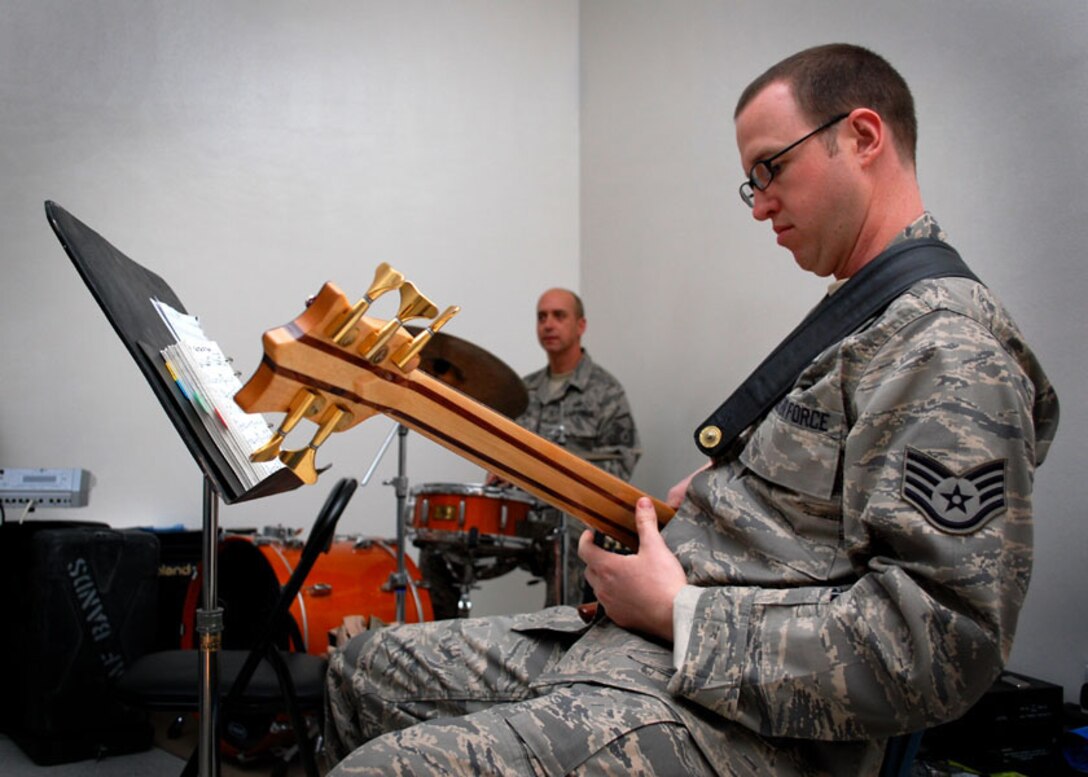 SSgt James Ryan, AFCENT Band Bass Player, performs with "Oasis". The Band is currently on tour to the Middle East, performing live music with a mission to maintain troop morale for U.S. and Coalition forces stationed all across the AOR. SSgt Ryan is from Columbus, Ohio and is stationed at Langley AFB, Virginia.