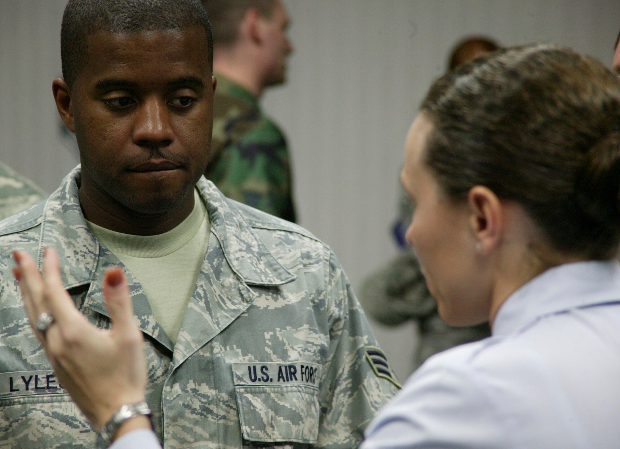 SHAW AIR FORCE BASE, S.C.-- Senior Airman Scott Lyles asks Tech. Sgt. Danica Eusay, a Basic Military Training instructor on the MTI Recruiting Team, questions about life as an MTI at the Airman Leadership School auditorium Feb. 10. (U.S. Air Force photo/Staff Sgt. Holly Brown)