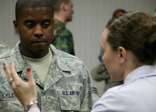 SHAW AIR FORCE BASE, S.C.-- Senior Airman Scott Lyles asks Tech. Sgt. Danica Eusay, a Basic Military Training instructor on the MTI Recruiting Team, questions about life as an MTI at the Airman Leadership School auditorium Feb. 10. (U.S. Air Force photo/Staff Sgt. Holly Brown)