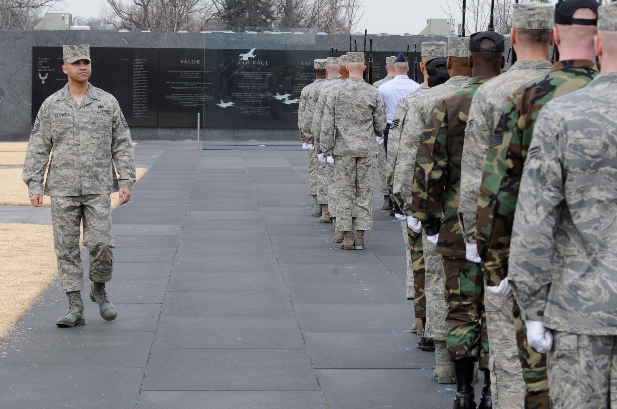 Master Sgt. Richard Hopewell, United States Air Force Honor Guard, inspects Airmen from the Honor Guard Feb. 10 at the National Air Force Memorial as they practice for the upcoming ceremonial season. More than 90 ceremonial guardsmen participated in the practice of the arrival and wreath laying ceremonies that will take place at the memorial through the year. The ceremonies are attended by senior military leaders from all over the world. (U.S. Air Force photo by Staff Sgt. Dan DeCook) 