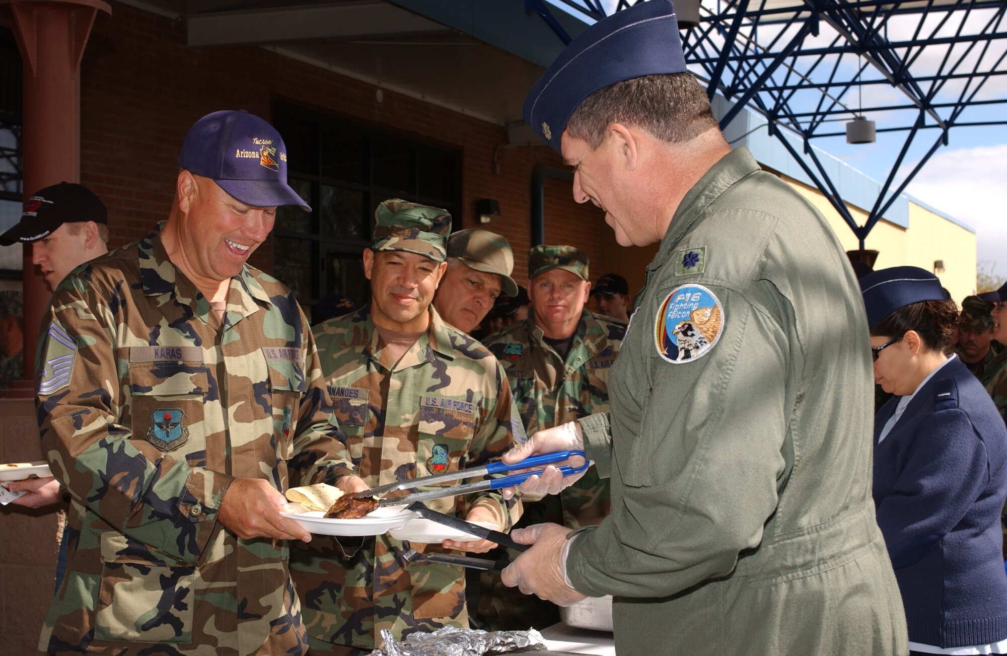 Lt. Col. Mitch Rebman serves a steak to Senior Master Sgt. Brian Karas. This year’s Steak Fry event was the most highly attended in wing history. At 947 served, the event exceeded last year’s participation by about 300 members. (Air National Guard photo by Senior Airman Sara Elliott)