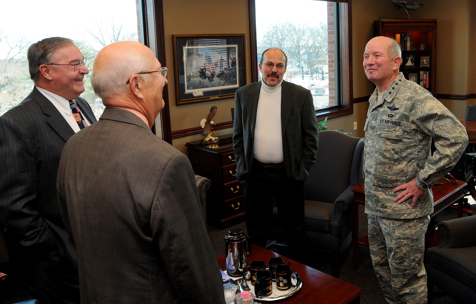 SCOTT AIR FORCE BASE, Ill. -- Gen. Duncan J. McNabb, United States Transportation Command commander, chats with a group of visiting area mayors, Feb. 3, in his USTRANSCOM office. Mayors pictured here are, left to right, Gerald Daugherty, Mascoutah, Gary Graham, O'Fallon and James Vernier, Shiloh.  After meeting with General McNabb, the mayors viewed the command briefing and received a tour of USTRANSCOM facilities.  (Photo courtesy Bob Fehringer)