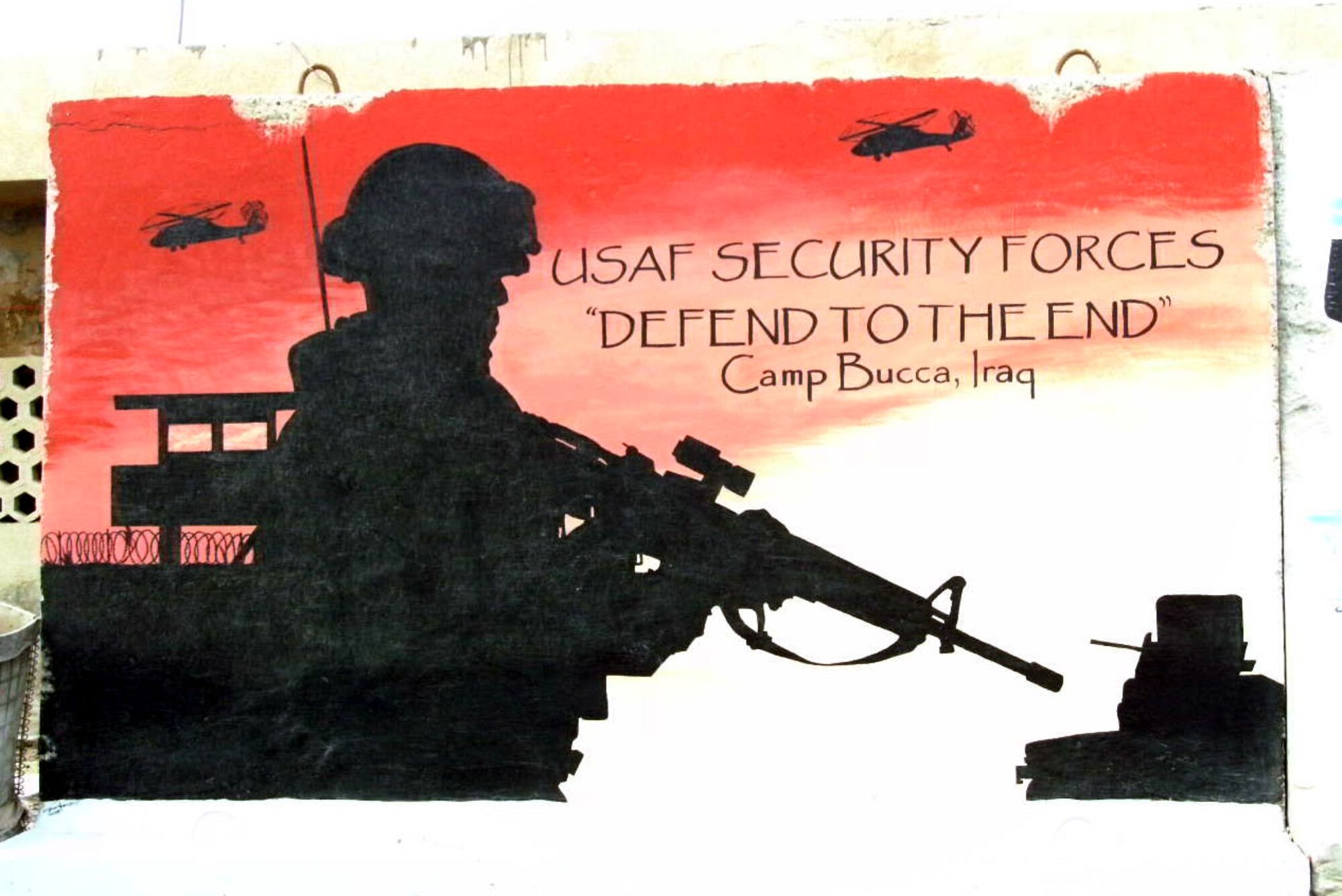 The motto of the deployed security forces members is etched on a sign. (U.S. Air Force courtesy photo)              