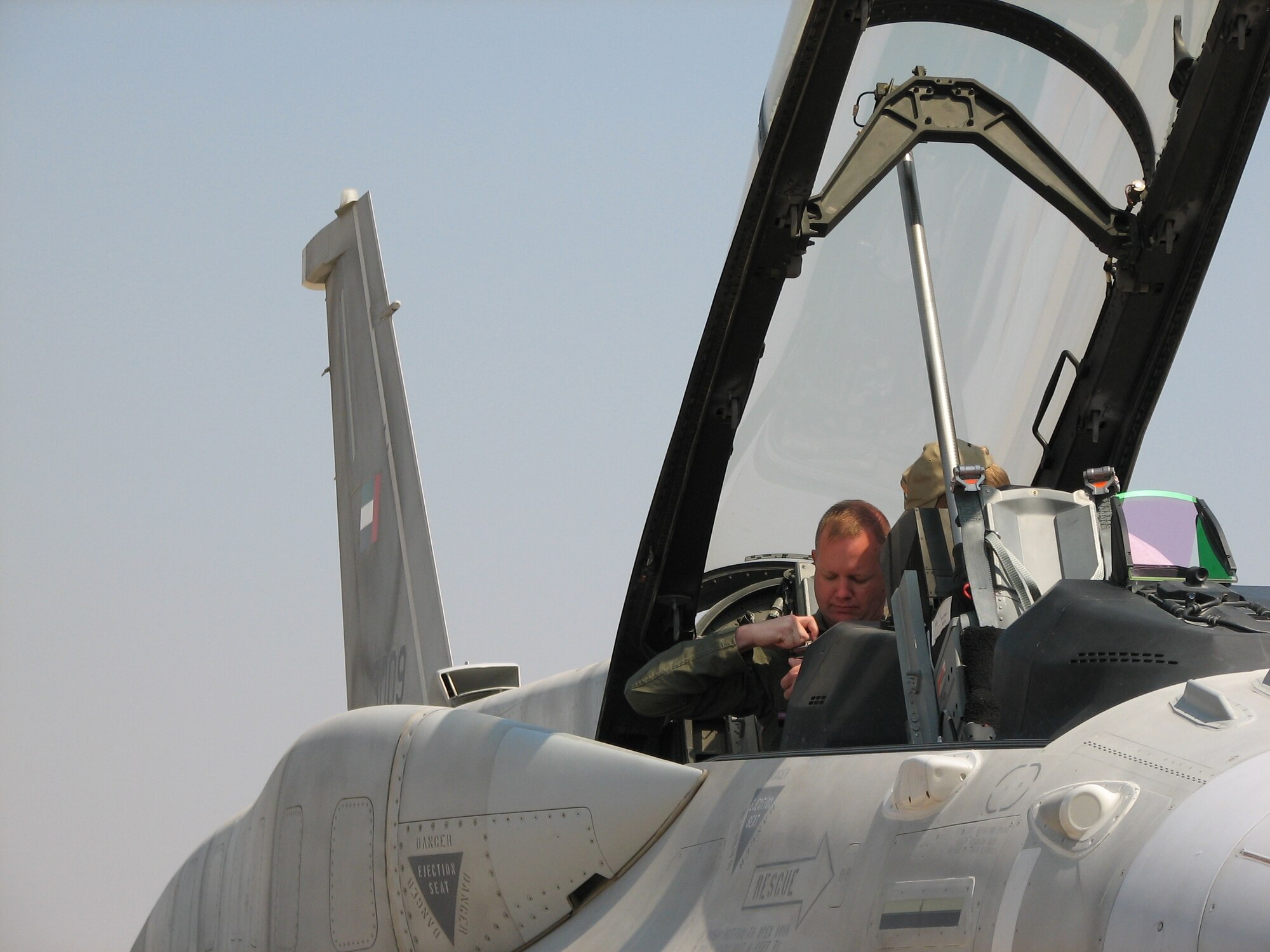 Lt. Col. Mike Benham, 13th Air Force chief of safety at Hickam Air Force Base, Hawaii, gets ready for an orientation flight Feb. 9 in a United Arab Emirates F-16 fighter at the Aero India 09 air show at Air Force Station Yelahanaka, India. Colonel Benham is acting as operations officer for the U.S. aircraft and personnel at the air show, which runs through Feb. 11. (U.S. Air Force photo/Maj. Sam Highley)
