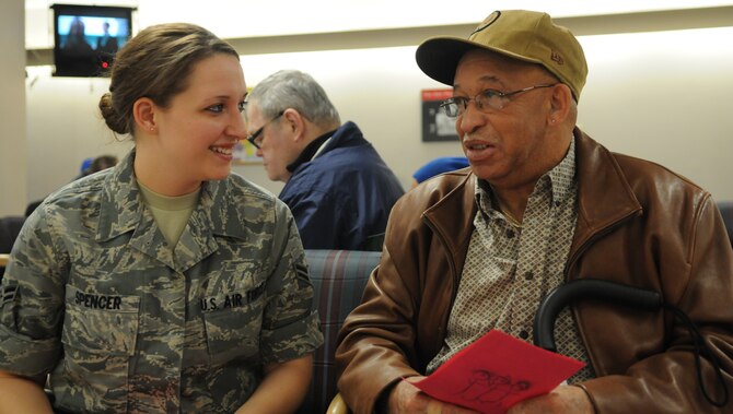 Airman 1st Class Amber D. Spencer, 579th Medical Group, talks with a veteran Feb. 9 at the Baltimore Veterans Affairs Medical Center. More than 35 Airmen from Bolling and the Pentagon visited the hospital to spend time with the patients, hand out T-shirts and Valentine’s Day cards. (U.S. Air Force photo by Senior Airman R. Michael Longoria) 

