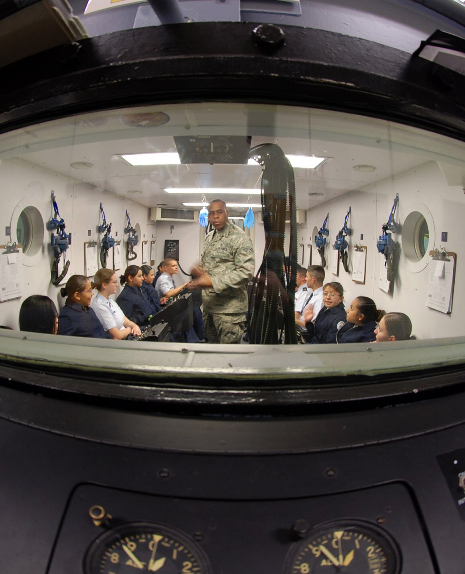 LAUGHLIN AIR FORCE BASE, Texas – Senior Airman Brian Evans, Aerospace Physiology technician, explains how oxygen equipment is used to teach Specialized Undergraduate Pilot Training students how to stay safe at high altitudes to a group of Del Rio High School Junior Reserve Officer Corps students during their day-long tour of Laughlin Feb. 11. (U.S. Air Force photo by Airman 1st Class Sara Csurilla)