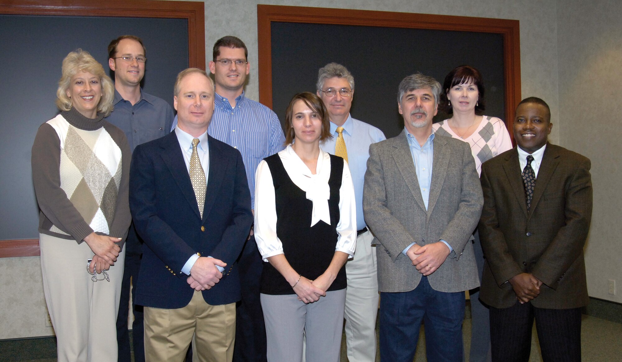 Engineering personnel recently recognized and celebrated several of their own who received advanced degrees.  Front from left are; Beth Murray, EN Long Term Training program manager; Rick McIver, Shanna Tate, David Hansen and Roger Jones, chief, Engineering Resources Divison. Back from left are; Kyle Polk, Craig Williamson, Stewart Ohler and Ronda Boruty, EN training manager. (Air Force photo/Margo Wright)