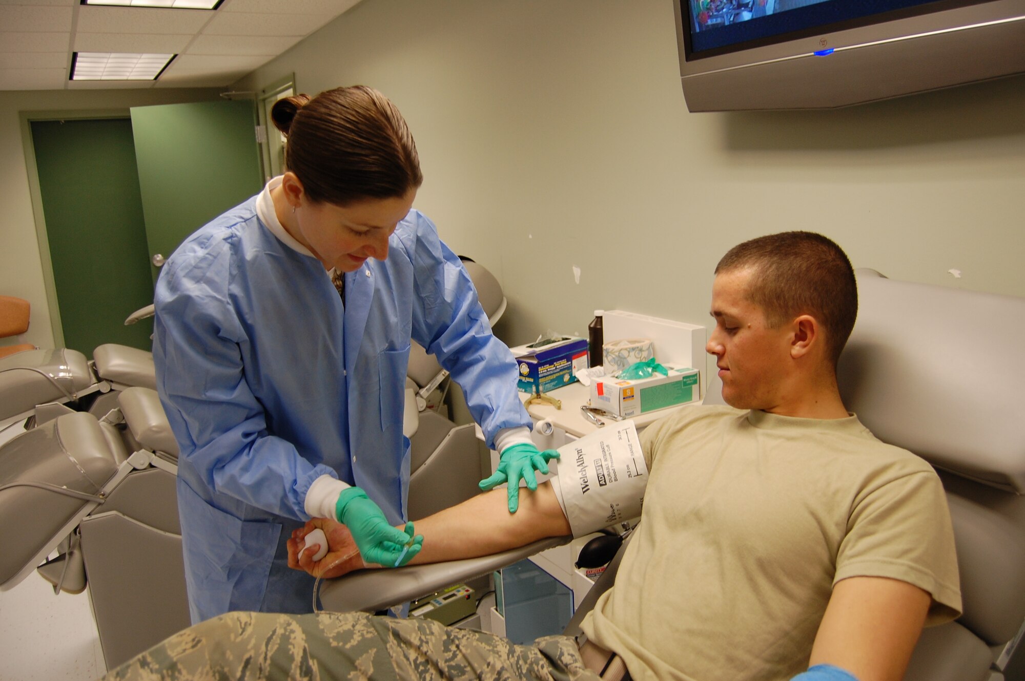 Photos by Steve Pivnick
Medical laboratory technician Serena Chiellini prepares Airman Basic Austin Morgan, 336th Training Squadron, to give blood at the donor center.  (U.S. Air Force photo by Steve Pivnick)