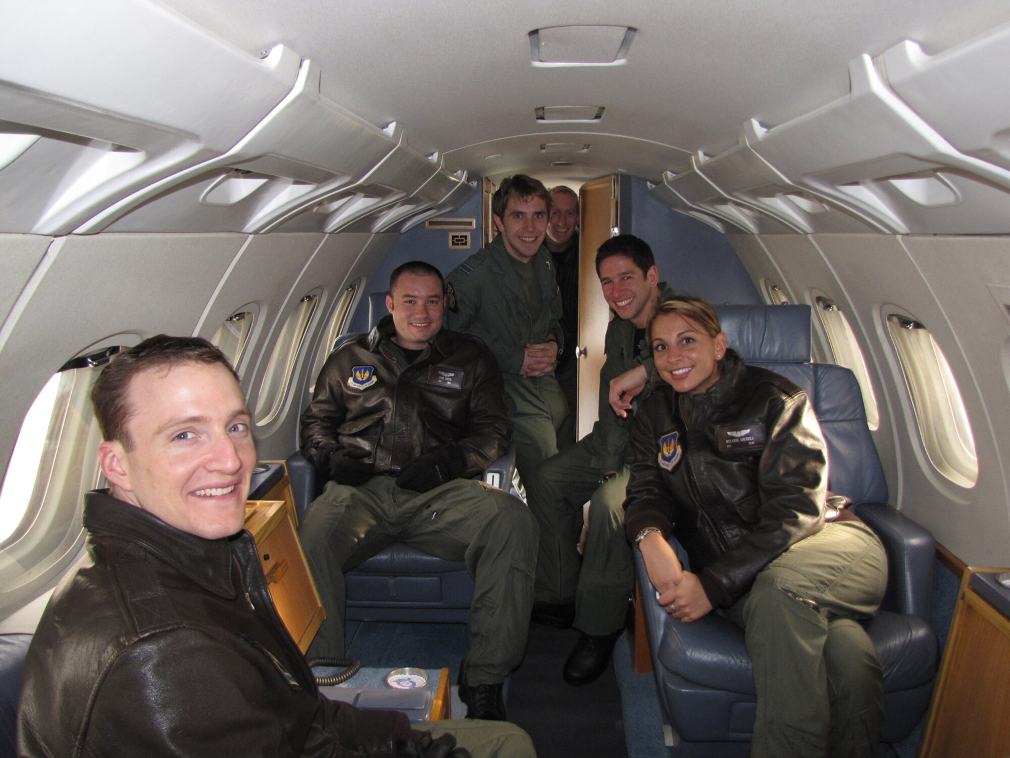 Crewmembers from the 76th Airlift Squadron and Airmen from 32nd British Royal Air Force Squadron pose for a picture on the BAE 125 jet at Royal Air Force Northolt, Jan. 30. The allied get together was the second-ever engagement for the sister Distinguished Visitor airlift squadrons and provided a forum to build upon their growing partnership. The 76th Airlift Squadron, the U.S. Air Force’s largest and most diverse operational support airlift squadron, flies the C-40B to support large-team Combatant Commander travel, the C-20H for four-star support and the C-21A for other high ranking officials and support missions. The 32 (The Royal) Squadron flies the BAE 146 to support the Queen and Prime Minister, the BAE 125 to support general officers equivalents and the Agusta 109 helicopter for shorter trips in England. (U.S. Air Force courtesy photo)