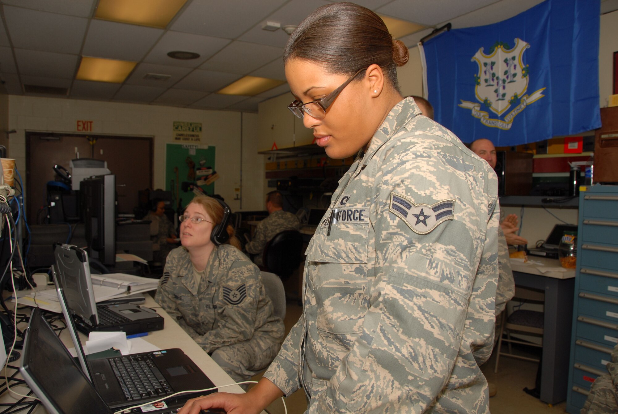 Airman 1st Class Desiree Patterson, aerospace control and warning systems apprentice, 103d Air Operations Group, establishes connectivity to a live video feed of the Presidential Inauguration, Jan. 20, 2009.  The Connecticut National Guard deployed 12 personnel to Andrews Air Force Base where they supplied a full spectrum of communication services to Joint Task Force District of Columbia.  (U.S. Air Force Photo by Staff Sgt. Erin McNamara)