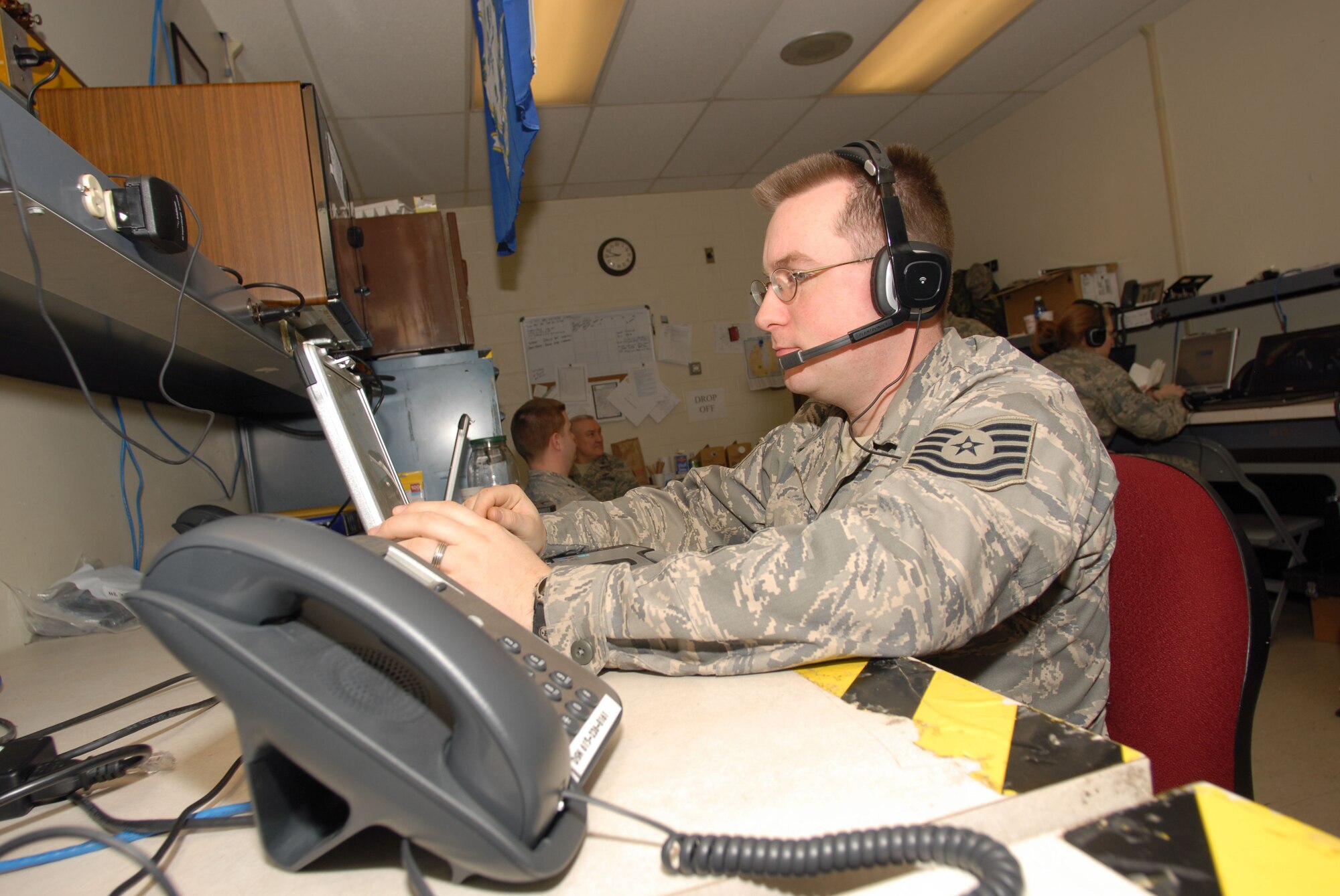 Tech. Sgt. Brett Mazur, logistics specialist with the 103rd Air Operations Group, Connecticut Air National Guard, uses Radio Interoperability Software to monitor communications traffic Tuesday Jan. 20, 2009, in support of Joint Task Force District of Columbia and the Presidential Inauguration, while deployed to Andrews Air Force Base, MD.   (U.S. Air Force Photo by Staff Sgt. Erin McNamara)
