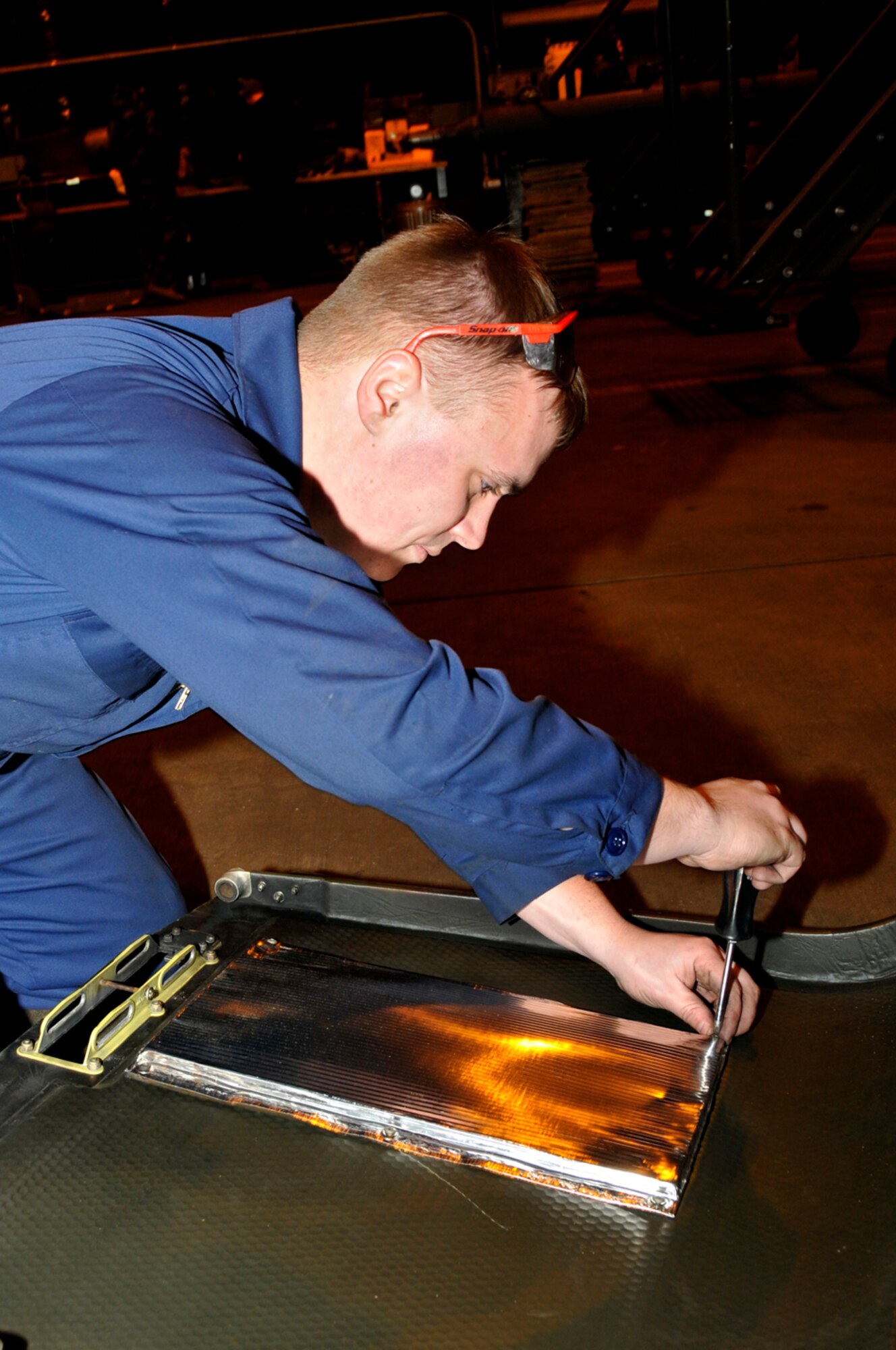 Staff Sgt. Trevor Smith, 56 Aircraft Maintenance unit crew chief, replaces the engine blanket on the engine compartment door of an HH-60G Pave Hawk Jan. 27 at RAF Lakenheath, England. The Pave Hawk is going through a Phase Inspection, which ensures the overall integrity of the aircraft. (U.S. Air Force photo by Airman 1st Class Perry Aston)