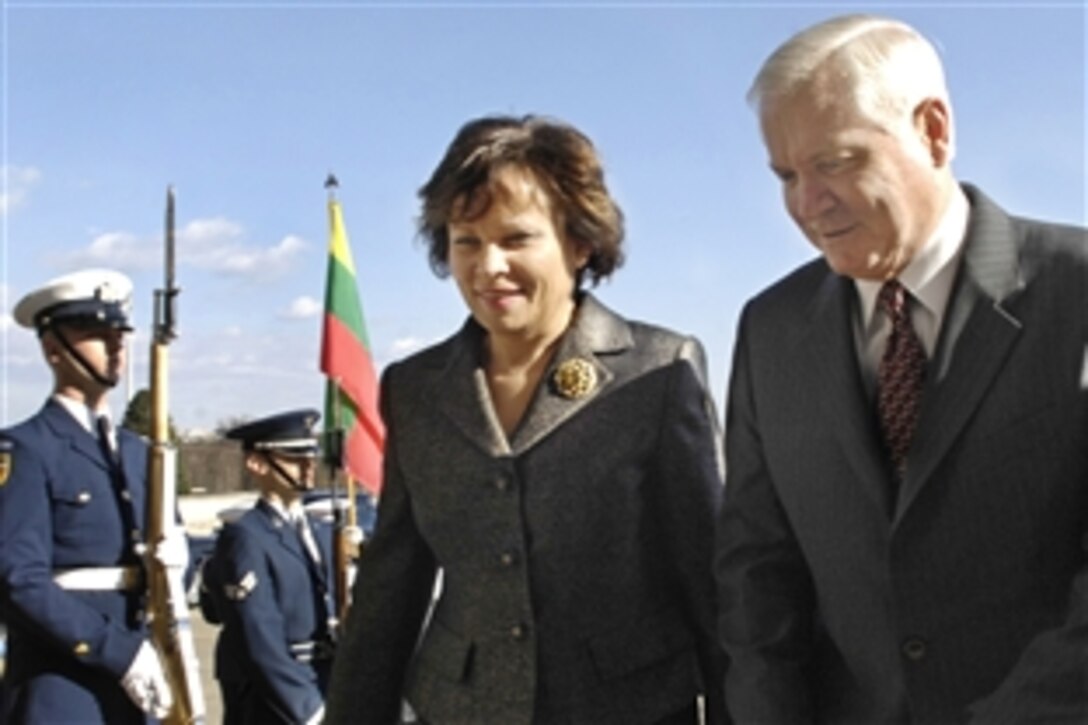 Defense Secretary Robert M. Gates, right, escorts Lithuanian Minister of Defense Rasa Jukneviciene through an honor cordon to discuss bilateral defense issues at the Pentagon, Feb. 12, 2009.  