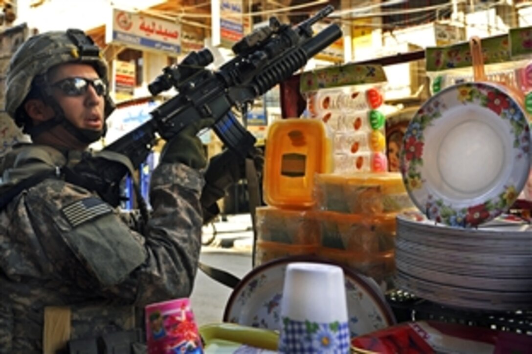 U.S. Army Sgt. Kevin Zuniga provides security while patrolling through a market in Mosul, Iraq, Feb. 4, 2009. Zuniga is assigned to the 1st Cavalry Division's 3rd Brigade Combat Team.