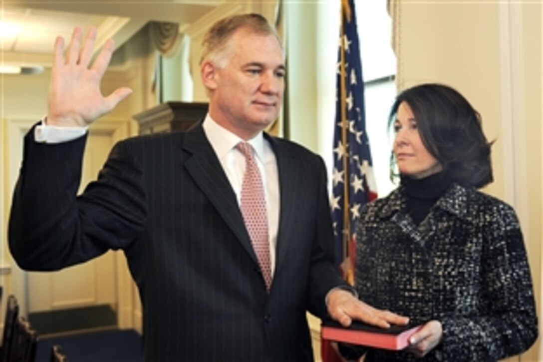 Deputy Defense Secretary William J. Lynn III is accompanied by his wife, Mary Murphy, while being sworn in at the Pentagon as the 30th Deputy Secretary of Defense, Feb. 12, 2009. Lynn previously served as the Defense Department's comptroller in the Clinton Admistration. 