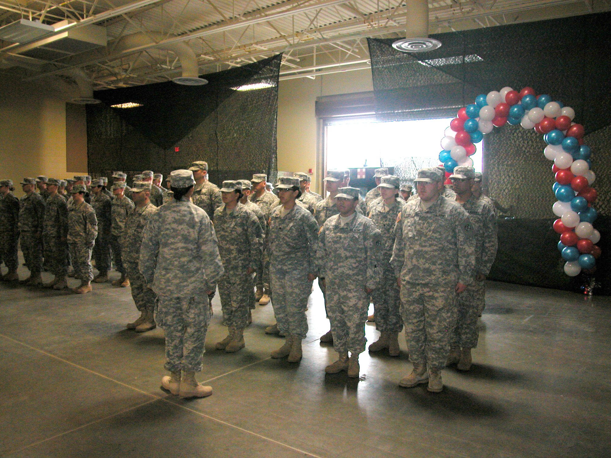 The 437th Medical Company (Ground Ambulance) form the troops during their deployment ceremony last Saturday at the National Guard Reserve Center on the open side of the base. The ceremony was attended by the Soldiers’ family and friends as well as senior leaders from their higher headquarters. (U.S. Air Force photo by Maj. Don Traud)