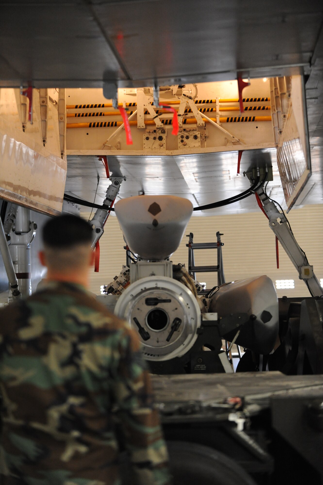 Staff Sgt. George Munoz, 28th Aircraft Maintenance Squadron load crew member, uses a power control unit to raise the conventional rotary launcher on a munitions handling unit during the 2009 bomb load competition, inspected by Eighth Air Force, Feb. 12. Ellsworth, Barksdale AFB, La., Minot AFB, N.D., Whiteman AFB, Mo., and Dyess AFB, Texas, were all inspected by Eighth Air Force during the competition. (U.S. Air Force photo/Senior Airman Anthony Sanchelli)
