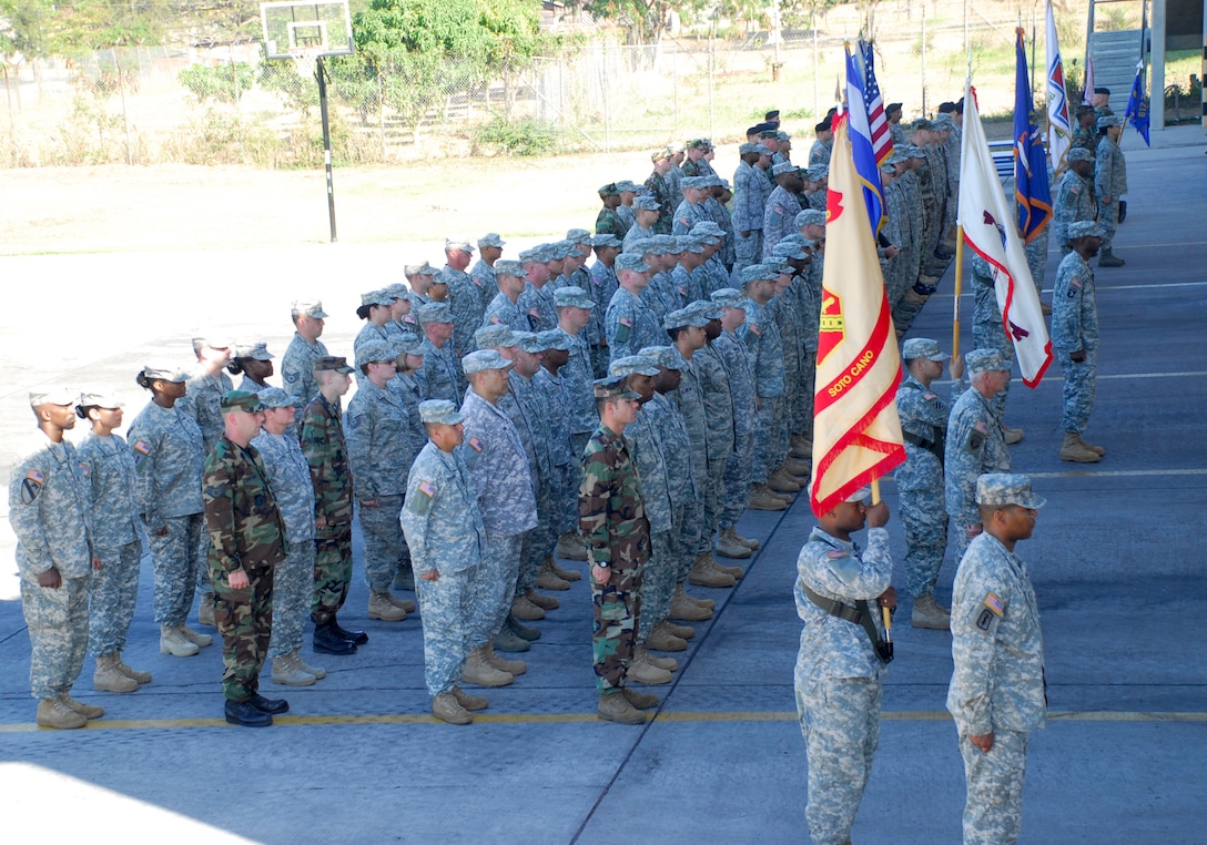 A formation of noncommissioned officers observes the official Change of Responsibility ceremony where Command Sgt. Maj. Eloy Alcivar accepted responsibility as Joint Task Force-Bravo's top enlisted member Feb. 11 at the Soto Cano Air Base fire department. (U.S. Air Force photo/Tech. Sgt. Rebecca Danet)