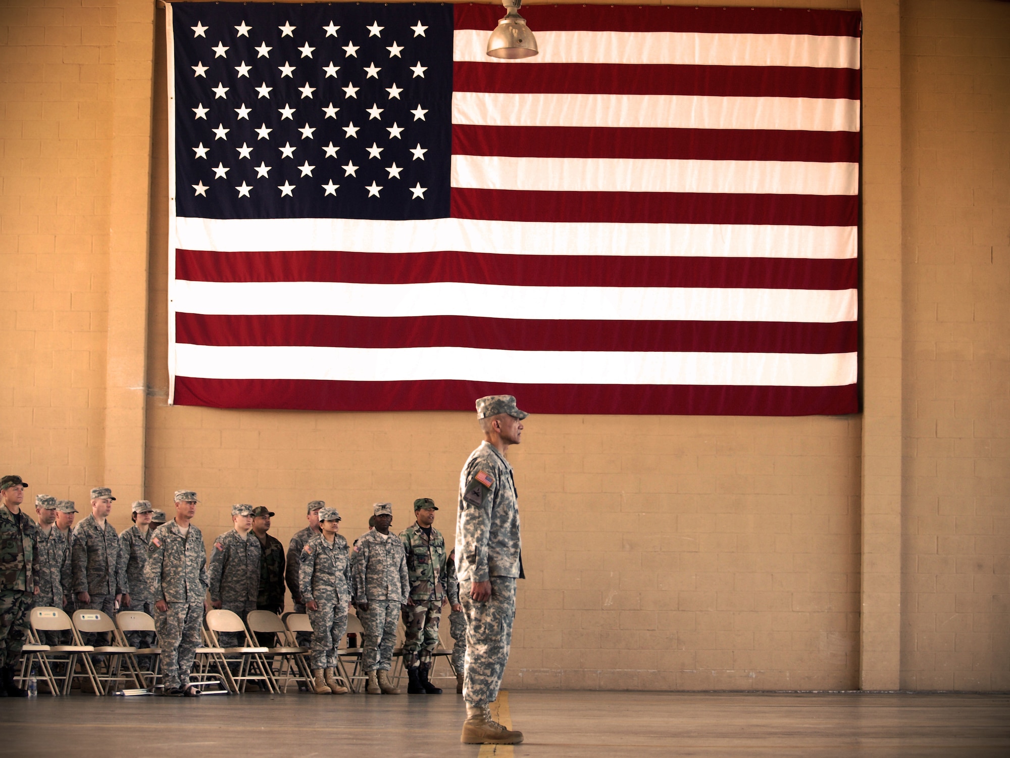 Command Sgt. Maj. Eloy Alcivar prepares to call the assembled formation to attention following his acceptance of responsibility as Joint Task Force-Bravo's top enlisted member at a Change of Responsibility ceremony Feb. 11 at the Soto Cano Air Base fire department. (U.S. Air Force photo/Staff Sgt. Matthew Huddle)