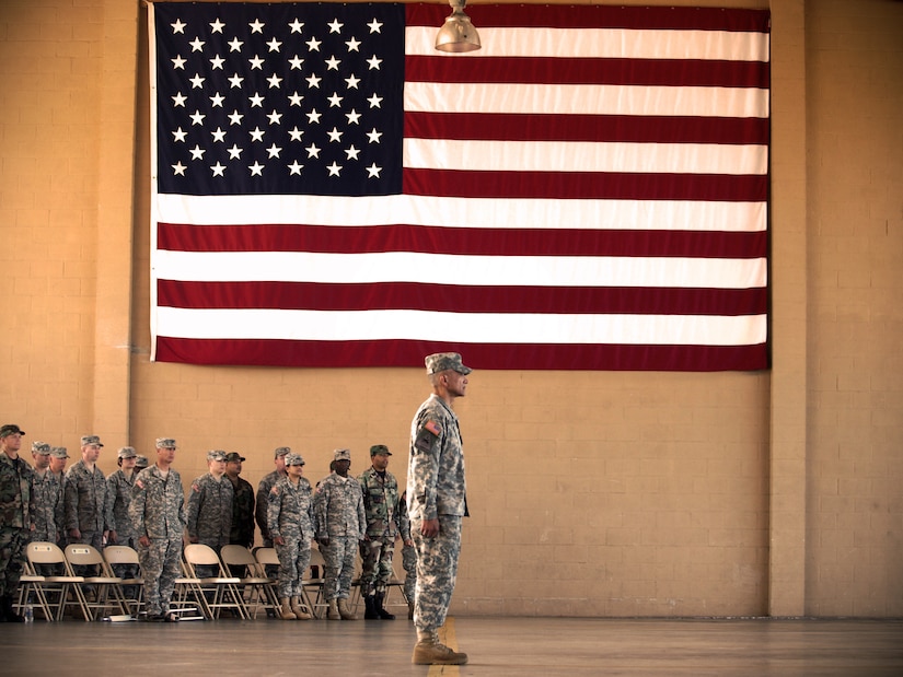 Command Sgt. Maj. Eloy Alcivar prepares to call the assembled formation to attention following his acceptance of responsibility as Joint Task Force-Bravo's top enlisted member at a Change of Responsibility ceremony Feb. 11 at the Soto Cano Air Base fire department. (U.S. Air Force photo/Staff Sgt. Matthew Huddle)