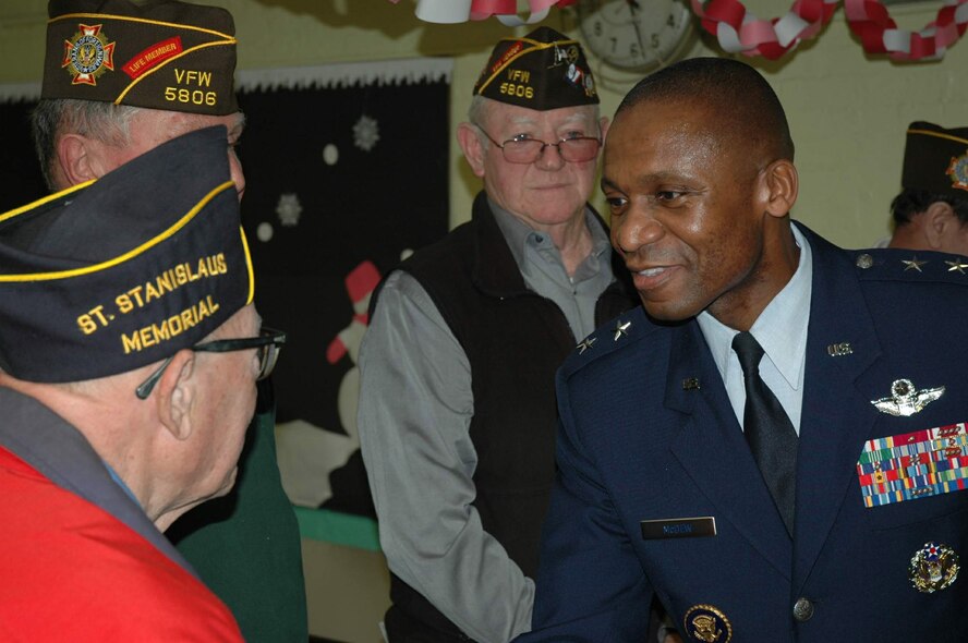 Maj. Gen. Darren W. McDew shakes hands with Brooklyn veterans during a citizenship day event at Public School 34 in Brooklyn, NY, Feb. 11. General McDew had previously spoken to fourth and fifth graders at the Brooklyn school about examples of excellence, where he pointed to the veterans in the audience as such individuals. General McDew is the director of Public Affairs, Office of the Secretary of the Air Force. (U.S. Air Force photo/Capt. Geoff Buteau)
