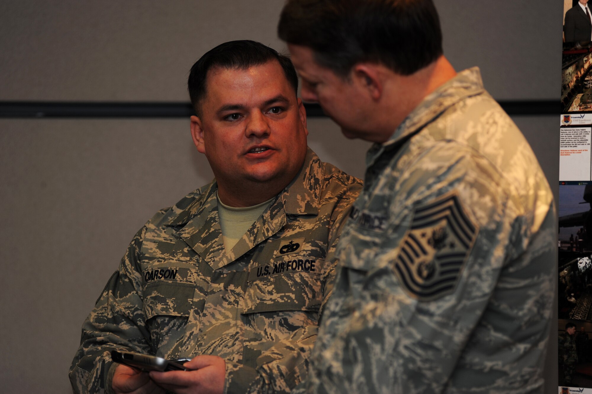 Tech. Sgt. James Carson, course director for the Mobility Operations School's Aerial Port Operations Course, briefs Chief Master Sgt. of the Air Force Rodney McKinley on the Mobile Learning Pilot Program on Feb. 10, 2009, at the U.S. Air Force Expeditionary Center on Fort Dix, N.J.  Chief McKinley visited McGuire Air Force Base and the Expeditionary Center to learn more about expeditionary training and operations in both areas.  (U.S. Air Force Photo/Staff Sgt. Nathan Bevier)