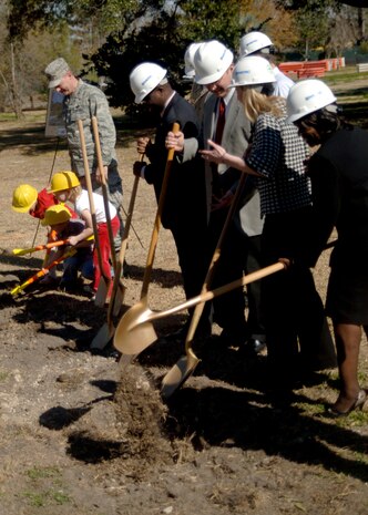 Key members of the community and Team Charleston join Col. John "Red" Millander in breaking ground at the site of the new Brig. Gen. Thomas R. Mikolajcik Child Development Center here Feb 13. The new facility will replace the existing 38-year-old CDC and will accommodate more than 300 children and will be more than two-and-a-half times the present center's current capacity. Colonel Millander is the Commander of the 437th Airlift Wing. (U.S. Air Force photo/Senior Airman Timothy Taylor)