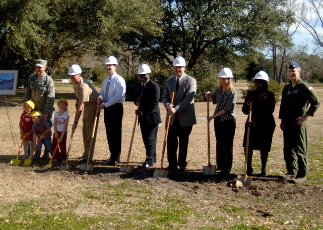 Key members of the community and Team Charleston join Col. John "Red" Millander and Col. Tim Wrighton in breaking ground at the site of the new Brig. Gen. Thomas R. Mikolajcik Child Development Center here Feb 13. The new facility will replace the existing 38-year-old CDC and will accommodate more than 300 children and will be more than two-and-a-half times the present center's current capacity. Colonel Millander is the commander of the 437th Airlift Wing and Colonel Wrighton is commander of the 315th Airlift Wing. (U.S. Air Force photo/Senior Airman Timothy Taylor)