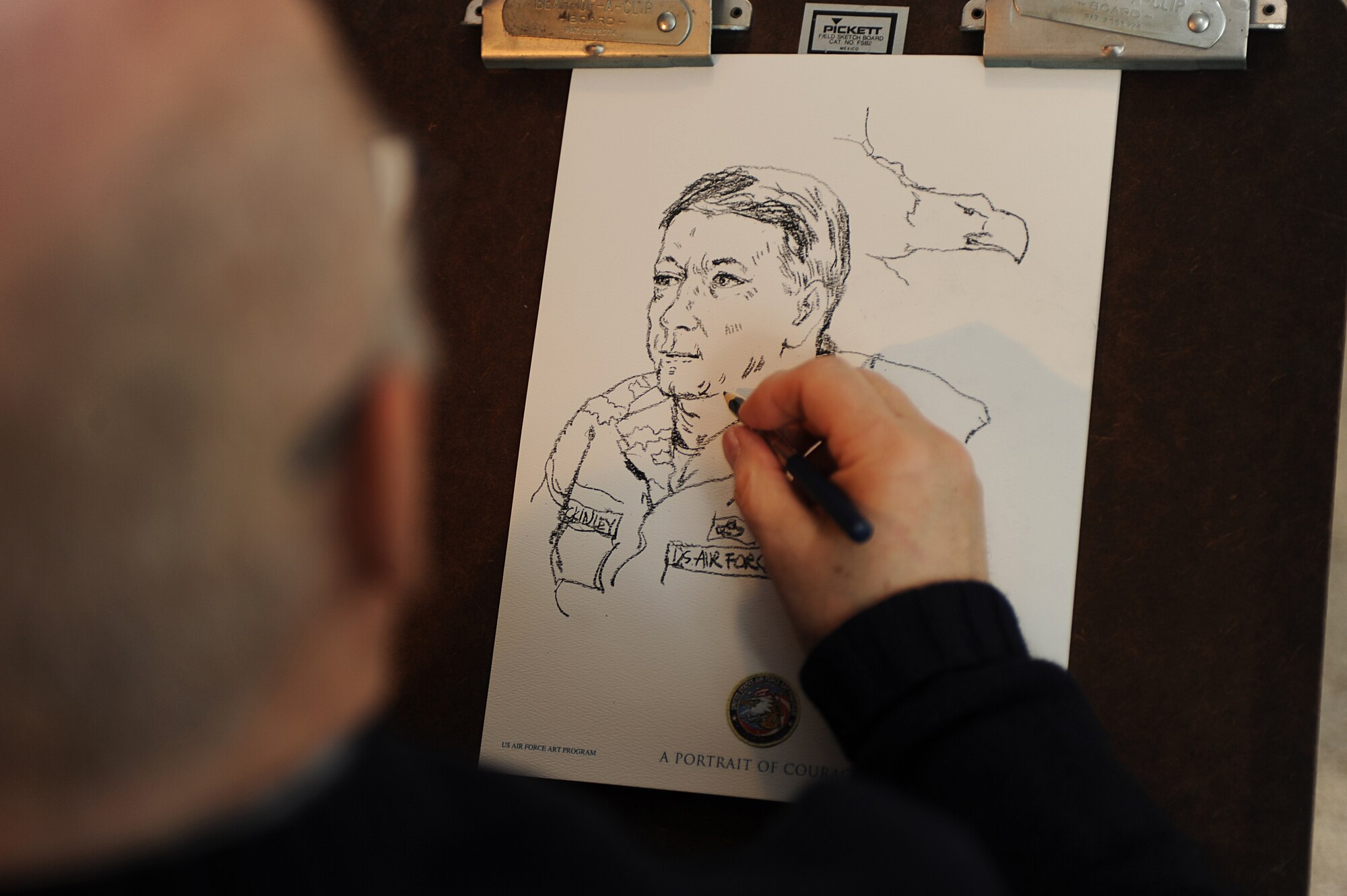 Artist John Witt, chairman of the New York Society of Illustrators, makes a sketch of Chief Master Sgt. of the Air Force Rodney McKinley on Feb. 10, 2009, during Chief McKinley’s visit to the U.S. Air Force Expeditionary Center on Fort Dix, N.J.  Chief McKinley visited McGuire Air Force Base and the Expeditionary Center to learn more about expeditionary training and operations in both areas. The sketch is now a piece in the Air Force Art Program. (U.S. Air Force Photo/Staff Sgt. Nathan Bevier)