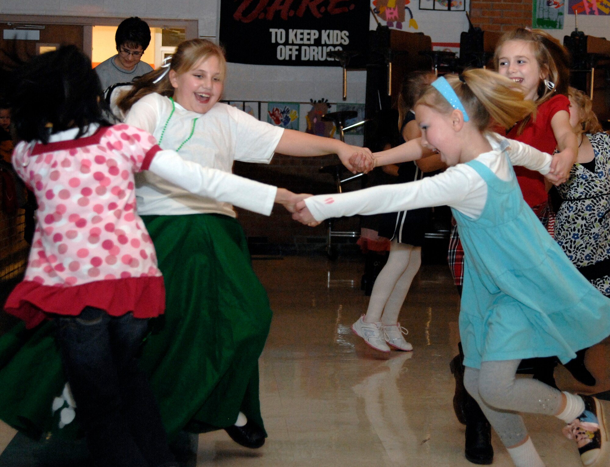 WHITEMAN AIR FORCE BASE, Mo. – Children dance together at the Whiteman Elementary School’s Valentine’s Day Dance Feb. 12. The theme for the dance was “Dancing through the Decades.” Children and their parents arrived dressed in attired from the 60’s through the 80’s and danced to classic songs from those eras. The dance was hosted by the Parents and Teachers Organization. (U.S. Air Force photo/Staff Sgt. Jason Barebo)