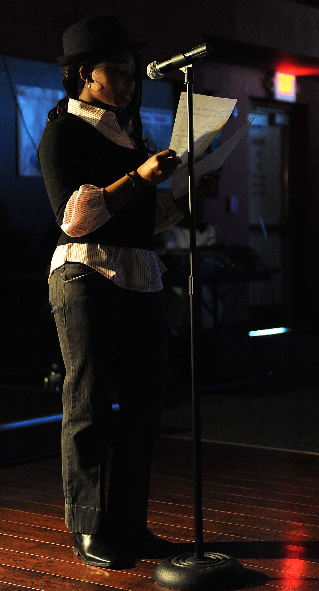 Damani Hoffman, daughter of retired Air Force Master Sgt. Dedra Hoffman, performs at the "Spoken Word 2009" presented by the African American Heritage Committee at Holloman Air Force Base, N.M., Feb. 9. The event featured some of Holloman's finest poets, dancers and singers. (U.S. Air Force photo/Senior Airman Michael Means). 