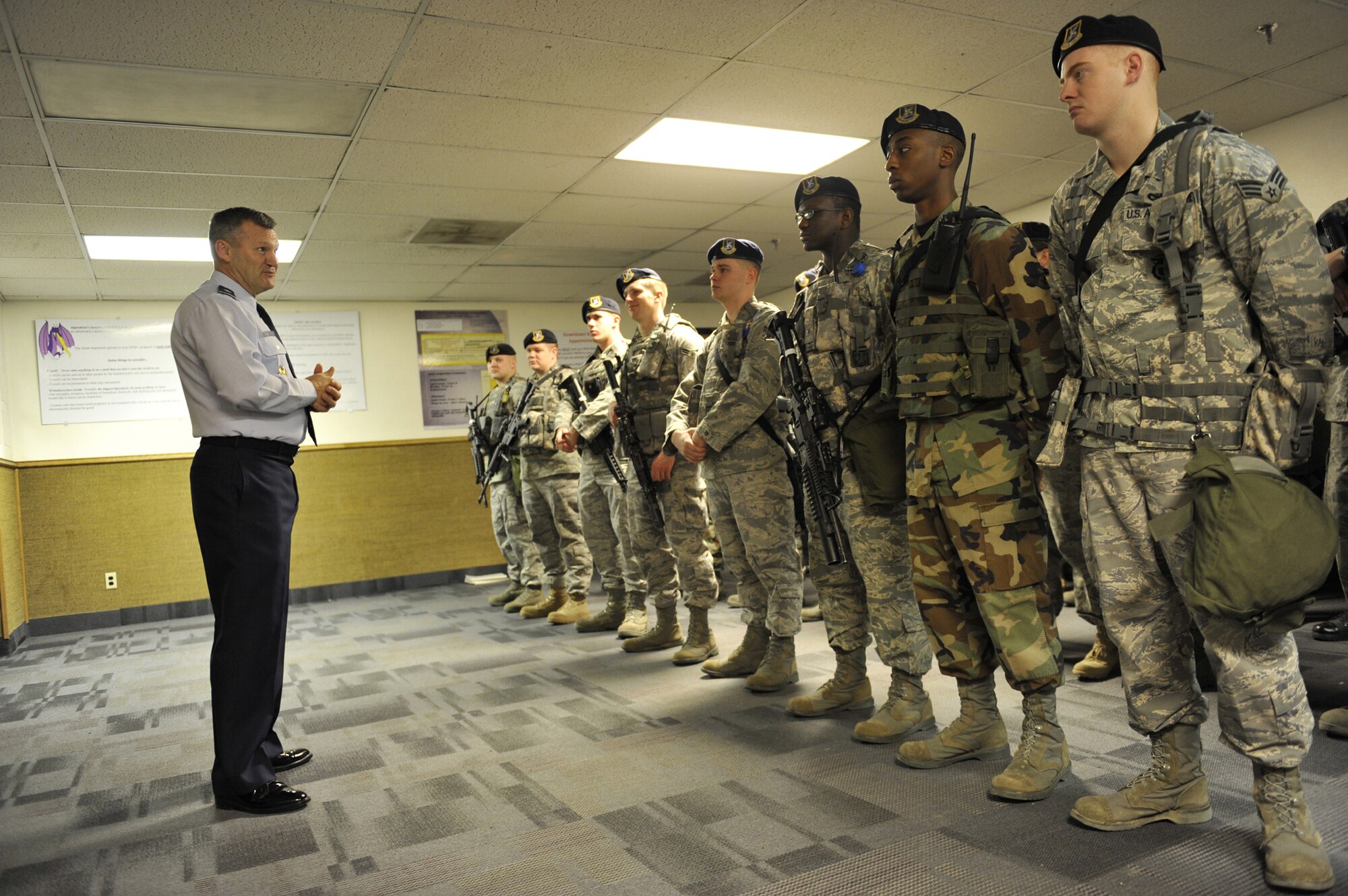 Chaplain (Brig. Gen.) David Cyr, Air Force deputy chief of chaplains, meets security forces members in guardmount prior to their deployment to the missile field Feb. 9. Chaplain Cyr toured several base facilities to meet Malmstrom Airmen before delivering a message at the 2009 National Prayer Luncheon. (U.S. Air Force photo/John Turner) 