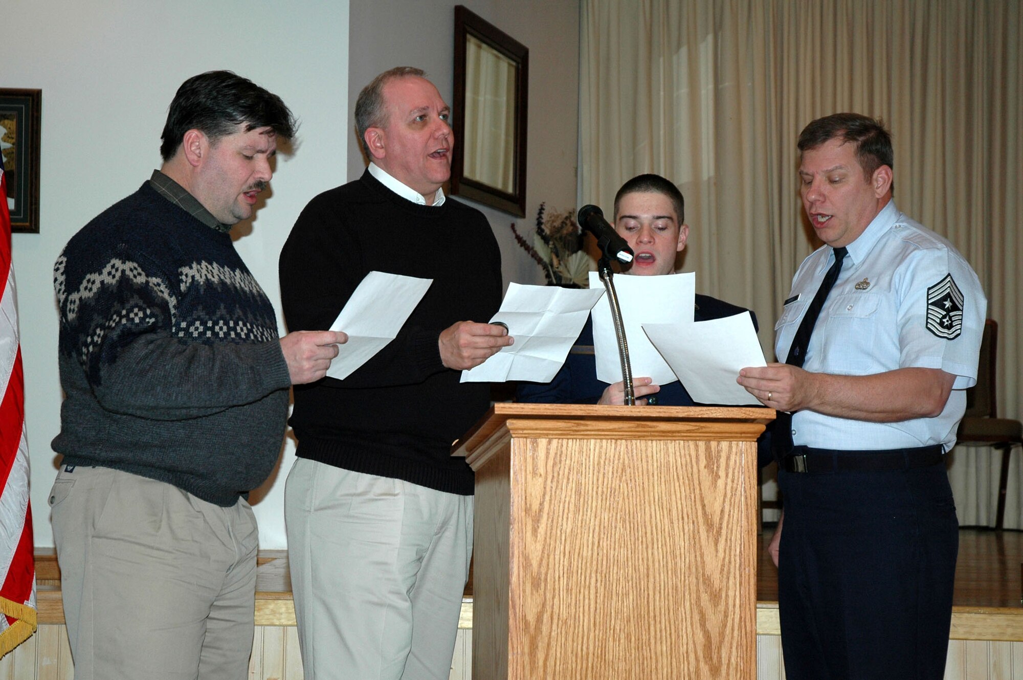 The Malmstrom Men's Ensemble sings America the Beautiful at the 2009 National Prayer Luncheon Feb. 9 at the Grizzly Bend Club. The guest speaker was Chaplain (Brig. Gen.) David Cyr, Air Force deputy chief of chaplains. (U.S. Air Force photo/Senior Airman Dillon White) 