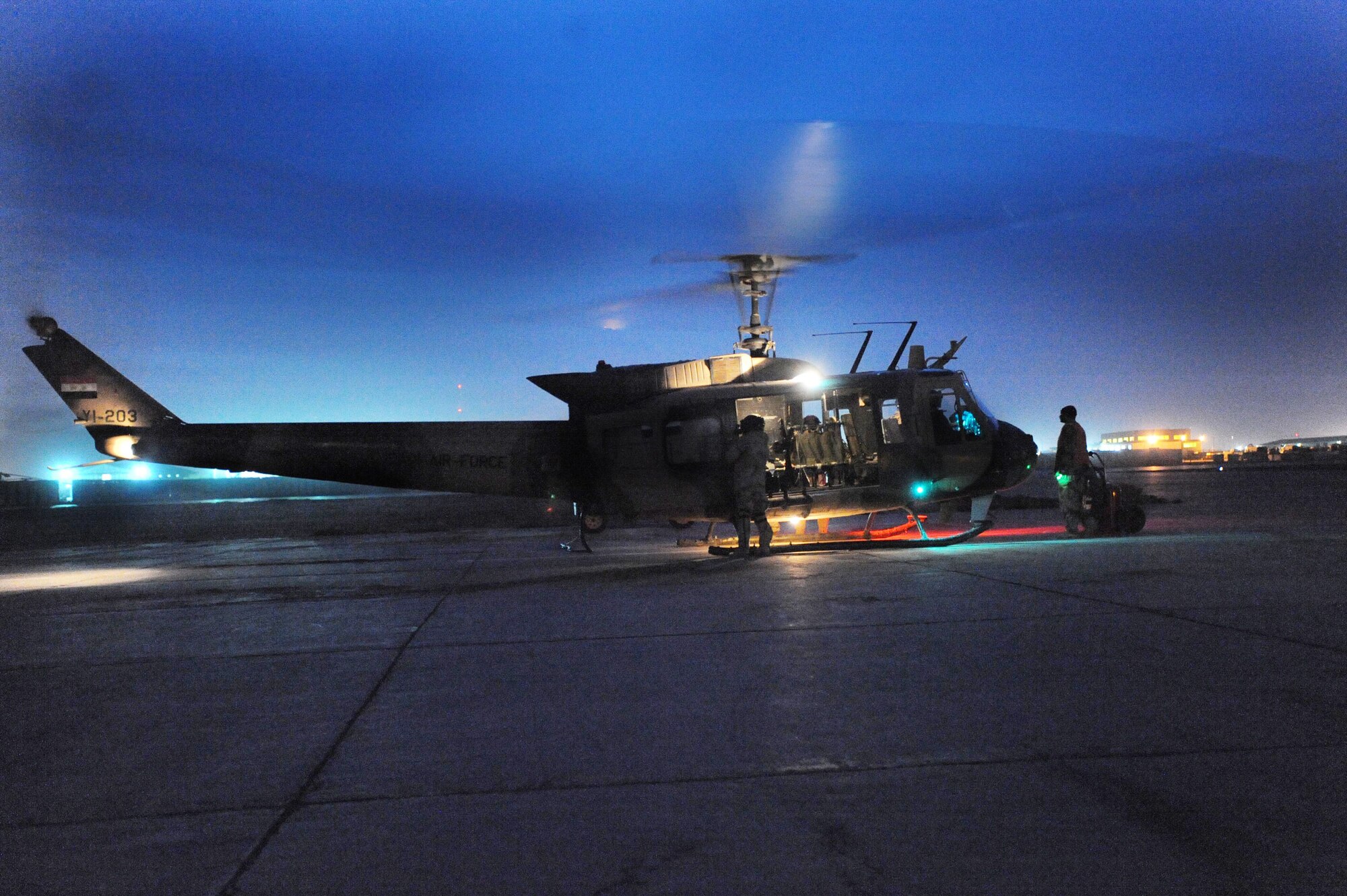 Aircrews from the Iraqi 2nd Squadron begin their first night-vision goggle certification flight with assistance from 721st Air Expedition Advisory Squadron at Camp Taji, Iraq, Feb. 8. (U.S. Army photo/Spc. Neil Stanfield)