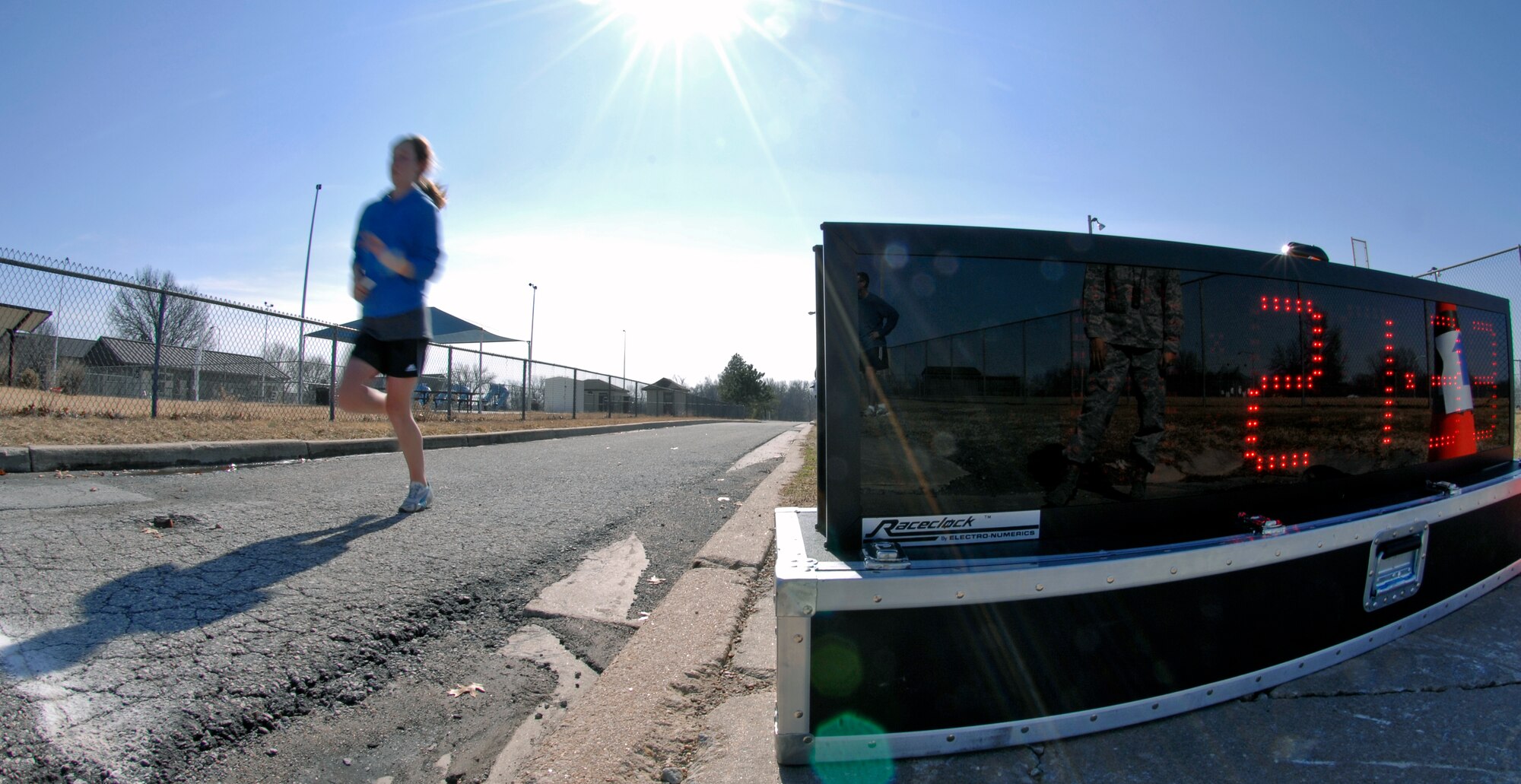 WHITEMAN AIR FORCE BASE, Mo.  – Megan Reed, daughter of Capt. Richard Reed, 509th Force Support Squadron, runs toward the finish line Feb. 12 during the Healthy Heart 5K Fun Run. Miss Reed finished the run with an official time of 21:34, placing first for females.  Captain Reed placed first for males with a time of 19:54. (U.S. Air Force photo/Staff Sgt. Jason Barebo)