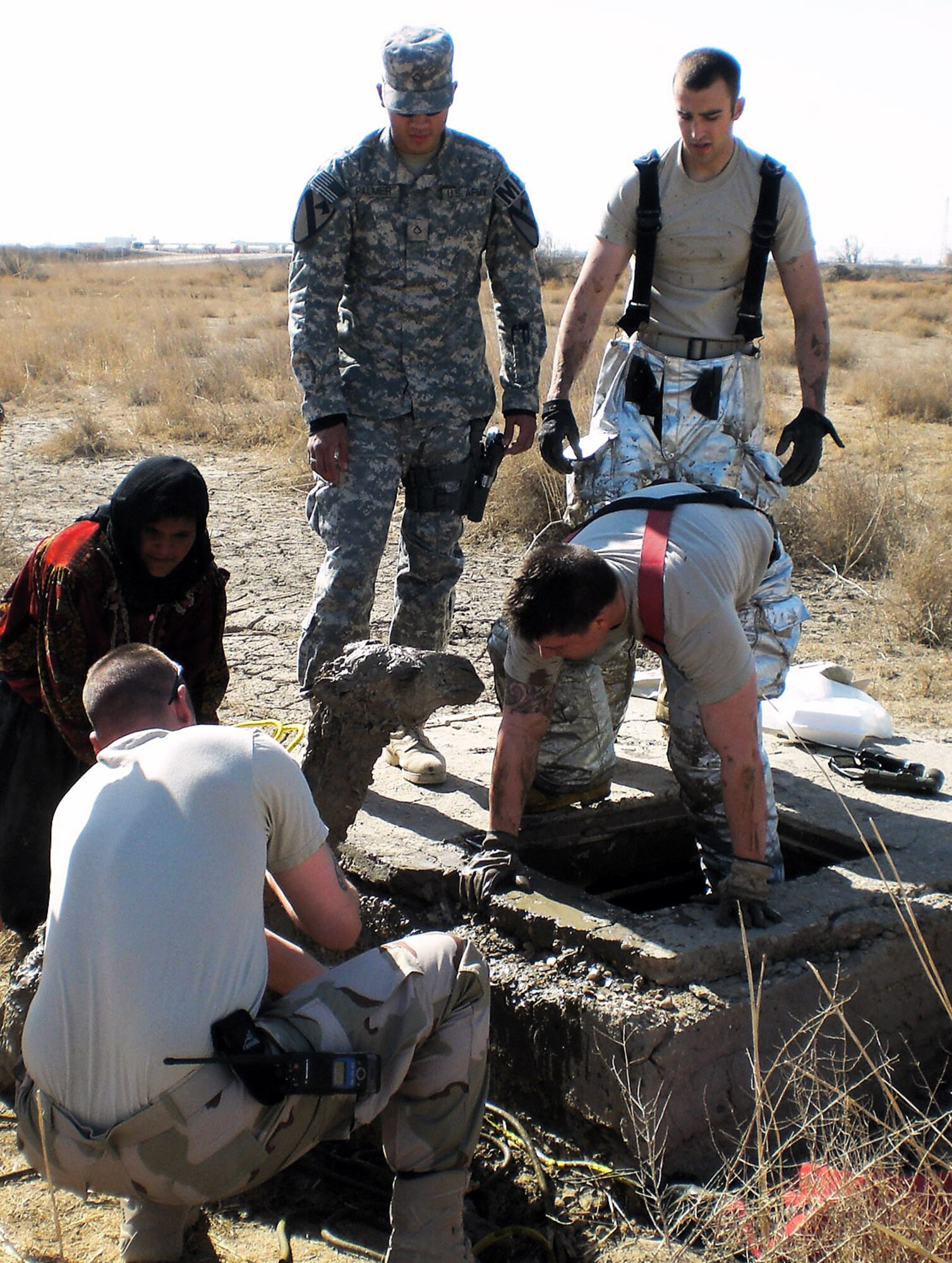 Firefighters rescue a baby camel trapped in a manhole near Ali Base, Iraq, Feb. 9. The firefighters are with the 407th Expeditionary Civil Engineer Squadron. (U.S. Air Force photo/Staff Sgt. Kenya Shiloh) 

