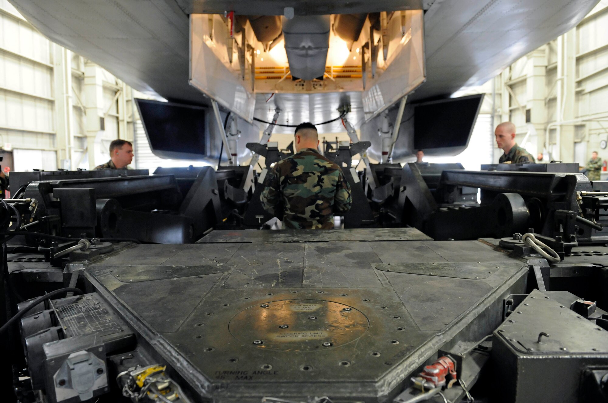 A team of load crew members from the 28th Aircraft Maintenance Squadron compete in the 2009 bomb load competition here, Feb. 12. The competition features the best load crews from five bomber bases and is scored and rated by evaluators from Eighth Air Force. (US Air Force photo/Airman 1st Class Corey Hook)
