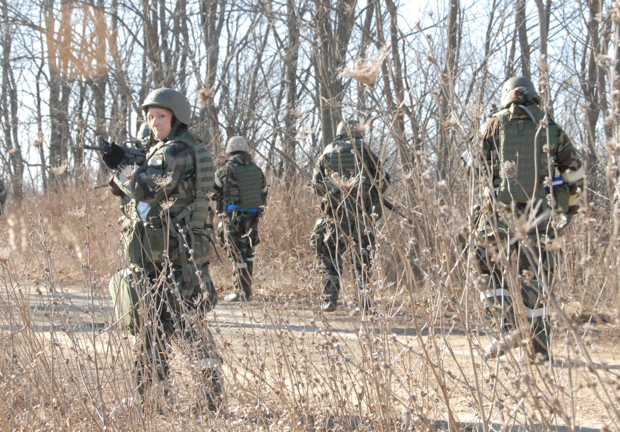 During a tactical exercise at Whiteman Air Force Base, Mo., Air Force reservist, Tech. Sgt. Kim Levy, and fellow 442nd Civil Engineer Squadron members, patrol a road in the exercise area.  The 442nd CES is part of the 442nd Fighter Wing, an Air Force Reserve Command A-10 Thunderbolt II fighter unit. (US Air Force photo/Master Sgt. Bill Huntington)
