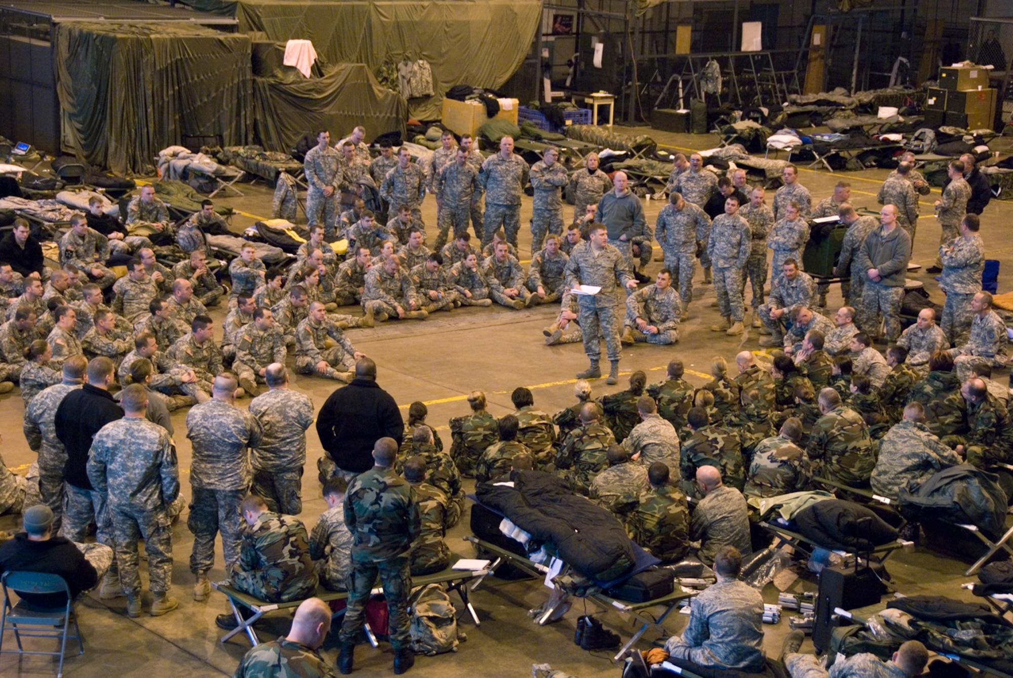 Members of the West Virginia National Guard's Chemical, Biological, Radiological/Nulcear, and Explosive- Enhanced Response Force Package  (CERF-P) gather for a briefing at the 167th Airlift Wing, Martinsburg, WV, on January 19, 2009. The guardsmen were on standby during the presidential inauguration to assist in case of emergency. (U.S. Air Force photo by Emily Beightol-Deyerle)